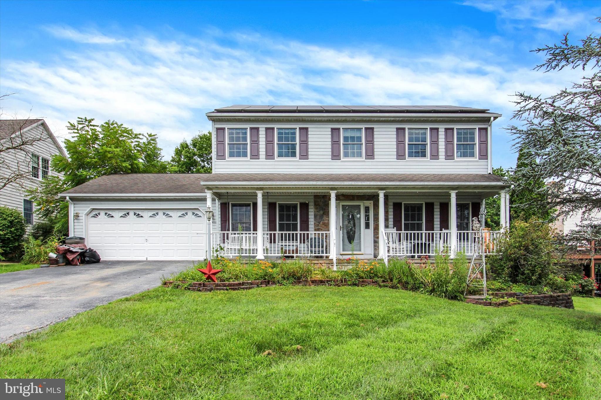 Sit on covered front porch and enjoy rare actual lakeview in this 1900 sqft (above-grade), plus partially finished basement, 3 bedroom, 2.5 bath, colonial on .37 acre lot in Lake Heritage, just 10 minutes from historic Gettysburg Square. All first floor rooms have lake views! 1st floor has all oak flooring with inlaid design and crown molding. Kitchen features recessed lighting, island, Corian countertops, gas stove, and dining area. Family room has wood-burning fireplace. Second floor primary bedroom has lake view, very large walk-in closet and full bath with double bowl sink. Rear sunroom has minisplit heatpump and vaulted ceiling. New propane furnace in 2023! Yard fenced in 2013. Owned solar panels make this house energy efficient. 2 car garage is fully dry-walled and has pull-down steps to attic space. Enjoy all that Lake Heritage has to offer: 150 acre lake for boating, skiing, fishing, and swimming, along with an Olympic-sized pool, community center, pavilions and picnic areas, playgrounds, tennis, beach volleyball, basketball, shuffleboard, 2 dog parks, community garden, walking path, clubs, etc. All this conveniently located very near Rts 15 and 97 for easy commuting !