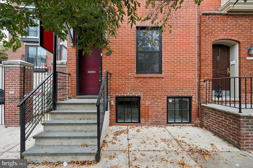 Welcome to 1023 E. Moyamensing Avenue in charming Queen Village. This trinity was completely renovated in 2018 and has restored hardwood flooring likely dating back to the home's original construction around 1862. The first floor features a decorative brick fireplace. Stepping down into the lower level, this home boasts a completely renovated eat-in kitchen with exposed beams, multi-directional lighting, and a suite of GE appliances including gas range, built-in microwave, dishwasher, and refrigerator.  Upgraded flat-panel cabinetry and tile backsplash complete the room. On the 2nd floor, you'll find a renovated bathroom with oversized walk-in tile shower featuring frameless glass enclosure. The bathroom also includes a premium vanity, dual-flush toilet, and custom tile back splash. On the same level, this room can be used as a junior bedroom and features a built in desk and shelving. Upstairs, the fourth floor features vaulted ceiling with exposed wood beams.  Renovation included updated roofing, electrical, and plumbing (tankless water heater).