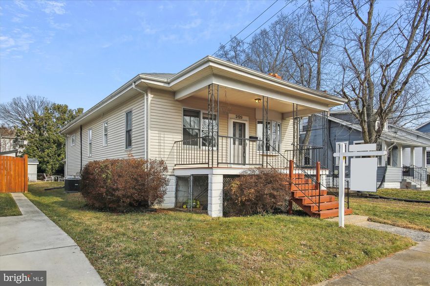 This adorable Craftsman bungalow is just 3-4 short blocks to Clarendon Metro on a quiet street and just  renovated.  Enjoy open floor plan with this expanded classic home with 4 bedrooms & 3 full bathrooms, central air and heat, cozy wood burning fireplace in living room that opens to dining and large kitchen with quartz counters and table space.  The 9 foot ceilings and new oak hardwood floors and fresh paint add to its Craftsman era character and charm.  And you will love the big front porch for lounging with friends.  Stroll just a few blocks to restaurants and shopping like Trader Joe's, Whole Foods, Clarendon Mall, Starbucks, and much more.  New Clay Park is just one block away, and Lyon Park is just 3 blocks away.  Call for a showing now.