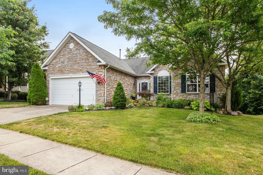 Welcome to Four Seasons -Resort Style living for active adults! This Immaculate Stone Front home situated on a corner/private lot with over 4000 square ft.  is move in ready! The main level boasts an open floorplan with split bedrooms. Hardwood flooring, family room with vaulted ceiling, triple windows and a gas fireplace. Upgraded kitchen with 42" cabinets, granite and stainless-steel appliances, french door refrigerator, formal dining room with French doors leading to deck. Three bedrooms on the main level, fourth bedroom on the lower level. Spacious Primary Suite with two closets, luxury bath with large shower and jetted soaking tub. Hall bath with a jetted walk-in tub, main level laundry room with front load washer and dryer. The lower level has a huge recreation room with a french door walkout, Large fourth bedroom with access to the full bathroom. Large storage area that can be finished for more living space. Private back yard with hardscaping, Private Upper-level deck and lower-level stone patio.  Oversized/Extended Two Car Garage. Four Seasons is a premier Active Adult gated community with a beautiful Clubhouse, Indoor pool/spa, outdoor pool, library, lounge areas, bocce ball/tennis/pickleball courts, putting green, nature trails, fitness center, ballroom, daily activities, entertainment, clubs & more!