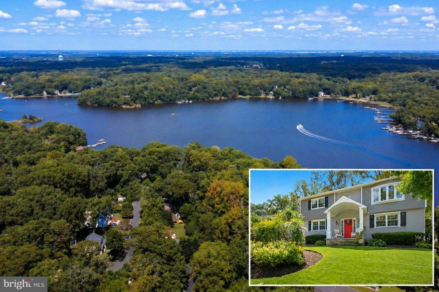 This is MOVE-IN READY BEAUTY is a raised rancher (NOT a split-foyer) in water-amenity rich Arden on the Severn/Sunrise Beach.  Need a home with 2 primary bedrooms on two different floors, one on the main level??  Here is your home!!  Before we discuss how great it looks, lets talk about the recent updates that have been made so you don't have to. The roof was replaced April 2025!  Brand new all-electric HVAC in April 2024! Front gutters installed in 2023. California Closet systems in Laundry and bottom bedroom and custom closets installed in upstairs bedroom in 2023.  Electricity, led lights, and laminate floors added to Shed/Clubhouse in back yard.  OK, lets go inside!  Completely updated and lovingly maintained!  The upper living area  has Hardwood floors throughout most of the home. Open concept gourmet kitchen with stainless steel appliances, tile backsplash, center island and gas range. This is an open-concept living space with a large living room and dining room that overlook the FANTATIC screened in porch that backs to the wooded nature preserve.  Your biggest challenge will be to decide whether to eat inside or out.  There is also primary bedroom with gorgeous ensuite bath and a second large bedroom and additional full bath as well on this level.  The amazing lower level features a huge family room with pellet stove and a slider to the lower deck and back yard. There are also two additional bedrooms on this main level and a gorgeous bathroom with a dual entry connecting it to one of the bedrooms. The outside is such a fantastic retreat! Large screened porch with stairs to the yard and lower level deck as well.. Incredible 24x16 workshop/clubhouse with a woodstove and private yard backing to 1600 acres of parkland.  Truly a showcase in every way! Arden on the Severn has a $22 a year mandatory fee, plus a  $231 voluntary fee   for access to 4 beaches, 3 boat ramps and two additional kayak launches!