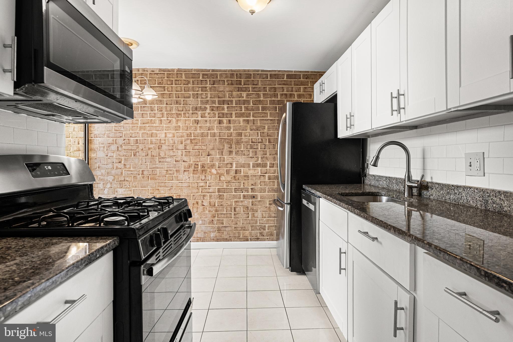 Priced To Sell Fast! Desirable 2rd Floor Condo, Spacious Kitchen with Stainless Steel Appliances, Tile Backsplash, GRANITE Counters, Spacious Bedrooms, Hardwood Floors, Washer and Dryer in Unit, Walk in Closets, Balcony with Wooded Views, Much More!! Close to Schools, Shopping and Commuter Routes. This Will Not Last!