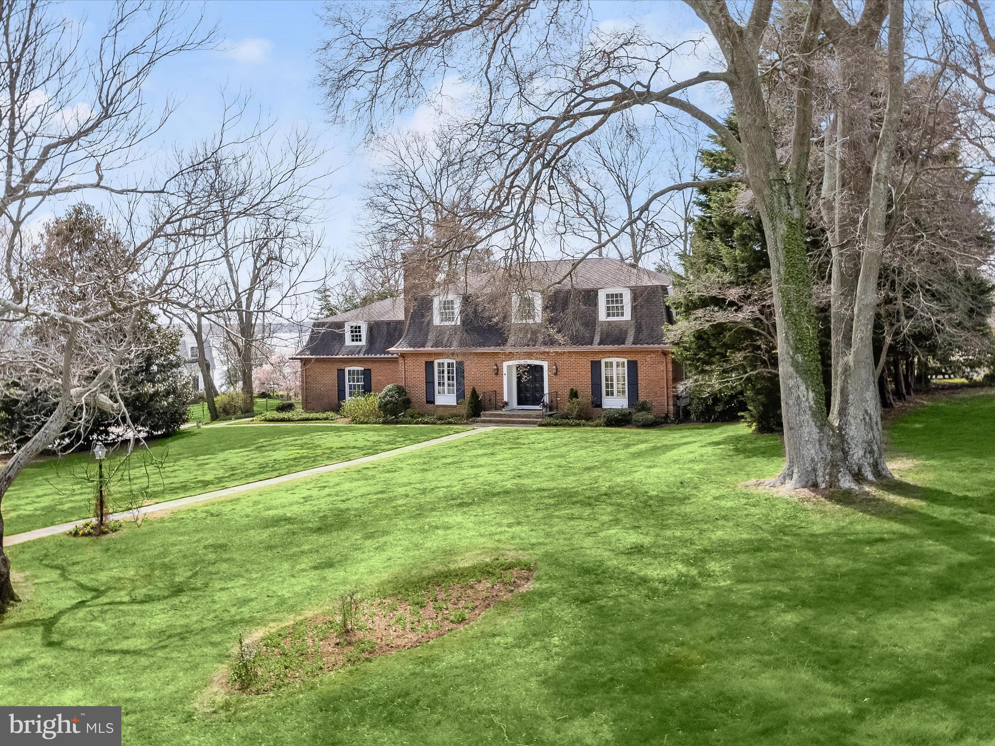 Just in time for summer! A lovely brick waterfront cottage graciously sits on a beautifully landscaped, large corner lot on Otter Pond, Gibson Island ‘s 43-acre freshwater spring fed lake, offering sweeping views, inside and out, of the lake and the Chesapeake Bay. With gleaming hardwood floors on the main and upper levels, this four bedroom, two and a half bath property offers an inviting table-size kitchen overlooking a cozy family room with wood burning fireplace. French doors in the kitchen open to the outdoor semicircular stone patio overlooking the lake and Chesapeake Bay. Park your car in the two-car garage and conveniently walk from the garage directly into the kitchen with your groceries. Entertain family and guests in the spacious dining room and good-sized living room with wood burning fireplace- both of these rooms also have French doors leading to the outdoor patio. A partially finished basement offers a rec room, laundry area and plenty of storage space. A large amount of storage space is above the garage and can be easily accessed upstairs.
Enjoy the wonderful water views as you barbecue on the built-in brick charcoal grill. Fish, swim, kayak, and canoe off the newly renovated, private dock. Separate steps lead directly to the water, providing delightful turtle watching and feeding of the ducks. There is a grassy area perfect for picnicking outside and enjoying the lake and Chesapeake Bay views. On .62 -acre, this delightful property provides quiet enjoyment of active wildlife such as heron, basking turtles, ducks and osprey, and hundreds of birds. Wildlife abounds!
Put your feet up and relax, and enjoy life on magical Gibson Island!
Information on Gibson Island:
Gibson Island is a private, secure island in the Chesapeake Bay within one hour of Washington, D.C. and Baltimore offering an absolutely extraordinary setting. The Island comprises 1000 acres with seven miles of shoreline. Two thirds of the Island is undeveloped and is owned by the Gibson Island Corporation, the homeowners' association. The remaining third is residential home sites.
Gibson Island is located on the western shore of Maryland, so there is no need to cross the Bay Bridge. On the Island is a 43-acre spring fed freshwater lake in which one may enjoy non-motorized watercraft activities such as paddleboarding, canoeing, kayaking, fishing and swimming.
The Island offers enormous privacy and security--there is an entry gatehouse staffed 24+Hours and the Island is patrolled by the Gibson Island Police Force (GIPD). The Gibson Island Corporation Service Department offers yard maintenance and landscaping and other services for homeowners. There is a full-service yacht yard. From the Island, it is just a 20-minute drive to BWI Airport and the neighboring Amtrak train station.
The Island houses a private country club (membership by invitation) offering yachting, fine dining year-round, tennis, an award-winning Charles Blair Macdonald designed 9-hole golf course, swimming, croquet, skeet shooting, and more. (C)