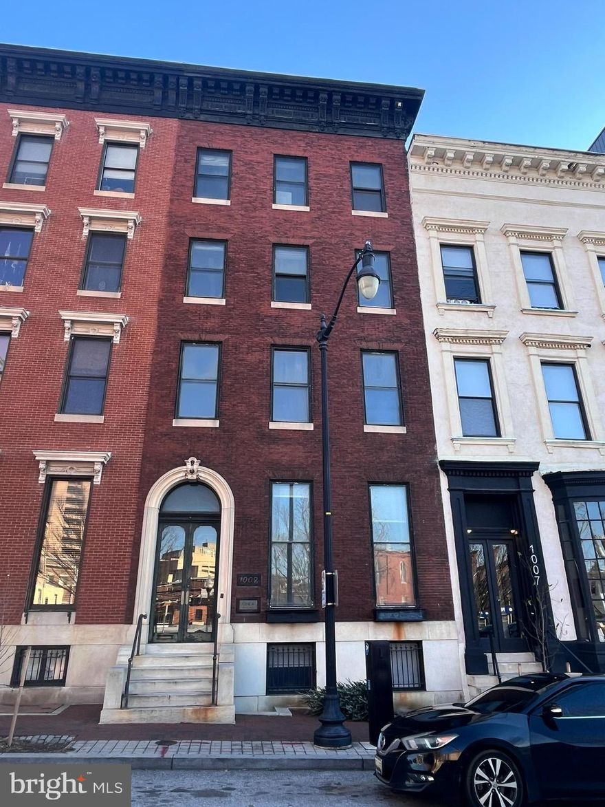 List price to be opening bid at online only auction.  Online auction to be conducted on Auctioneers website. Bidding begins Thursday, January 23rd & ends Tuesday, January 28, 2024 at 12:00PM. This is being sold in conjunction with 1011 N Charles Street.  The properties will be sold individually or as an entirety.   An exceptional opportunity awaits with this 10,019 +/- Sq. Ft. office building in Baltimore's prestigious Mount Vernon neighborhood. For many years, this address was home to Rita St. Clair Associates, a testament to the building's beautifully appointed interior and prime location. SITE: 25' X 184' +/- parcel zoned C-2 (Commercial) which is served by public water and sewer. IMPROVEMENTS: 5-Level building which contains 10,019 +/- sq. ft. of above-grade building area. Main Level: Enter this exceptional property from either the convenient parking area or via a separate entrance on Charles Street, and be immediately captivated by its exquisite original details. The grand main room impresses with rich parquet floors, ornate moldings, and a magnificent marble fireplace crowned by an intricately carved mantel and a gleaming gilded overmantel mirror. The adjacent room, adorned with mosaic tile floors, leaded glass windows, and elegant marble wainscoting, leads to the sophisticated library. This haven features parquet floors, a striking beamed ceiling, extensive built-in bookshelves with leaded glass doors, and a beautifully carved wood overmantel mirror above the fireplace. Lower Level: Features a reception area, conference room, 3 large work areas, bathroom and solarium. Second floor: 2 private offices, full bathroom and a work/file area.   Third floor: Unimproved space with 2 large work areas, office/storage and 2 fireplaces.   Fourth floor: Unimproved space with 2 large work areas, office/storage, stairway to attic and 2 fireplaces. The building has 4 parking spaces in the rear.  LOCATION: Mount Vernon is a designated National Landmark Historic District and a city Cultural District. It boasts stunning 19th century architecture and well kept parks. Being close to downtown, Mount Vernon is well-served by public transit and is blocks from Light Rail. The neighborhood is home to a mix of institutions, including the Peabody Conservatory, Walters Art Museum, University of Baltimore, Maryland Historical Society, Maryland Institute College of Art, Joseph Meyerhoff Symphony Hall, Baltimore School for the Arts, Lyric Opera House, Center Stage & much more! Zoning Code: Description of the C-2 Commercial Zone. The property is in a C-2, Community Commercial Zone. It allows for a variety of residential, institutional and commercial uses.  Pages 447-450 of the Baltimore City Zoning Code document, lists Permitted (P) and Conditional (CB & CO) Uses.   "10-204. C-2 Community Commercial District. (a) Areas for which intended. The C-2 Community Commercial Zoning District is intended for areas of small to medium scale commercial use, typically located along urban corridors, that are designed to accommodate pedestrians and, in some instances, automobiles. (b) Standards. The C-2 District standards are crafted to: (1) ensure compatibility among neighboring residential, commercial, and entertainment uses; (2) maintain the proper scale of commercial use; and (3) maintain a balance between high traffic volume and pedestrian circulation."Improved by a 5 level, 10,019 +/- SF commercial/office building.