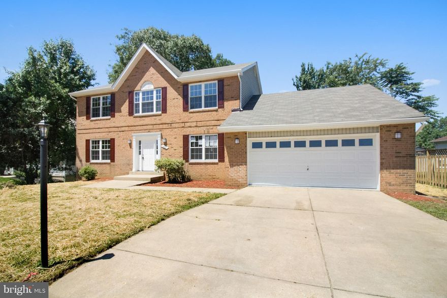 Gorgeous totally remodeled colonial home features spacious 3 bedrooms + den, 3 full bath, tastefully remodeled kitchen with granite countertops, SS appliances and recess lights that opens up to an inviting family room with fireplace. Fully finished walkout basement with den that can be used as a bedroom/office and full bath. Garage for 2 cars and large driveway that can fit up to 4 cars and more!