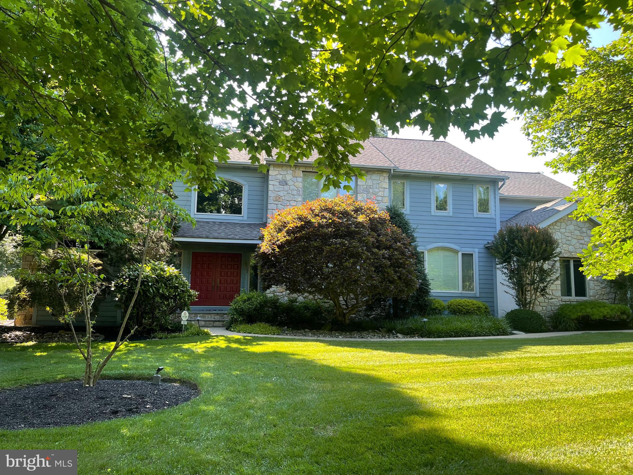 Welcome to this stunning executive residence, perfectly situated on a meticulously landscaped, premium lot in the award-winning Upper Dublin School District and highly desirable Dawesfield community, which offers the ideal blend of luxury, sophistication, space, and comfort. This Contemporary Masterpiece boasts 5 spacious bedrooms, 4 full bathrooms, 2 convenient half bathrooms, and a spacious 3-car garage with an EV charging system and the home is designed to accommodate both elegant entertaining and everyday living. Relax and enjoy POOLSIDE in the privacy of your own retreat; wrought iron fencing, mature trees, plantings, and gorgeous PA Bluestone surround a custom 9-foot deep HEATED GUNITE POOL with attached spa. Moving inside, you’ll find refined finishes, including hardwood floors, high ceilings, and a layout that seamlessly connects the main living areas. A grand 2-story foyer with a dramatic turned staircase greets you upon entry. To the left, the library features elegant French Doors, Custom-Built-Ins, and a Cozy Fireplace. To the right of the foyer, a formal Living Room showcases a stunning 3-sided fireplace, creating a warm ambiance from multiple angles, connecting the large Dining Room, with a handsome Granite Built-in Buffet and timeless Coffered Ceiling, adding both depth and a sense of luxury where guests will dine in comfort and style. Continuing our tour, your culinary creativity awaits in an expansive Eat-In Kitchen, immediately off of the Dining Room; the heart of the home features a chef’s dream kitchen with Top-of-the-line appliances including a Sub-Zero Refrigerator, Wolf Cook Top, Kitchen Aid Double Oven, crisp White 42-inch cabinets, Double Stainless Sinks, and massive Quartz Center Island with plenty of storage. Immediately off the Kitchen, step down to the sunken Family Room with a rustic Stone Fireplace and Corner Built-Ins, blending both form and function to create an inviting atmosphere. Moving from the Family Room, step into the vaulted Sunroom with exposed beams, floor-to-ceiling windows, and skylights with retractable shades, designed to bring the outdoors in, providing a bright, tranquil retreat with access to the backyard. And, for those rainy days, the first-floor Mud Room provides accessibility from the garage, acting as a buffer between the outdoors, offering plenty of additional storage, keeping your first floor clean and organized while providing access to the back staircase & private home office, ideal for remote work, with a half bathroom for added comfort and versatility. Ascending to the Second level, you’ll find a Jack & Jill Bathroom in addition to a full Hall Bath. The 5 generously sized Bedrooms offer ample closet space, natural light, and privacy, including the luxurious primary suite that serves as your sanctuary. Double Doors open to a private space with a defined Sleeping Space, 2 Walk-In Closets, a Cozy Seating Area, and a large ensuite with frameless glass shower with ceramic tile, enclosed water closet with bidet, heated platform jacuzzi tub and granite double sink with maple cabinetry, finishing this space in both style and comfort. Our tour concludes on the Lower Level, where the fully finished space features a Full Bathroom and offers endless possibilities for the bonus room, home theater, fitness area, or home office. And never worry about an interrupted power supply, the Whole House Generator will restore power for the entire home within seconds. With sleek architectural features, high-end finishes, and meticulous attention to detail throughout, this home is a rare blend of elegance and modern design. Conveniently located off Rts. 309, 476, 63, the PA Turnpike, and close to Septa’s Ft. Washington and Ambler Rail Lines for easy commuting. This home is walking distance to the Promenade’s refined restaurants and stores, and a short drive to Lifetime Fitness, Temple University Ambler, and Historic Ambler. This classic home is being sold with a 1-year home warranty.