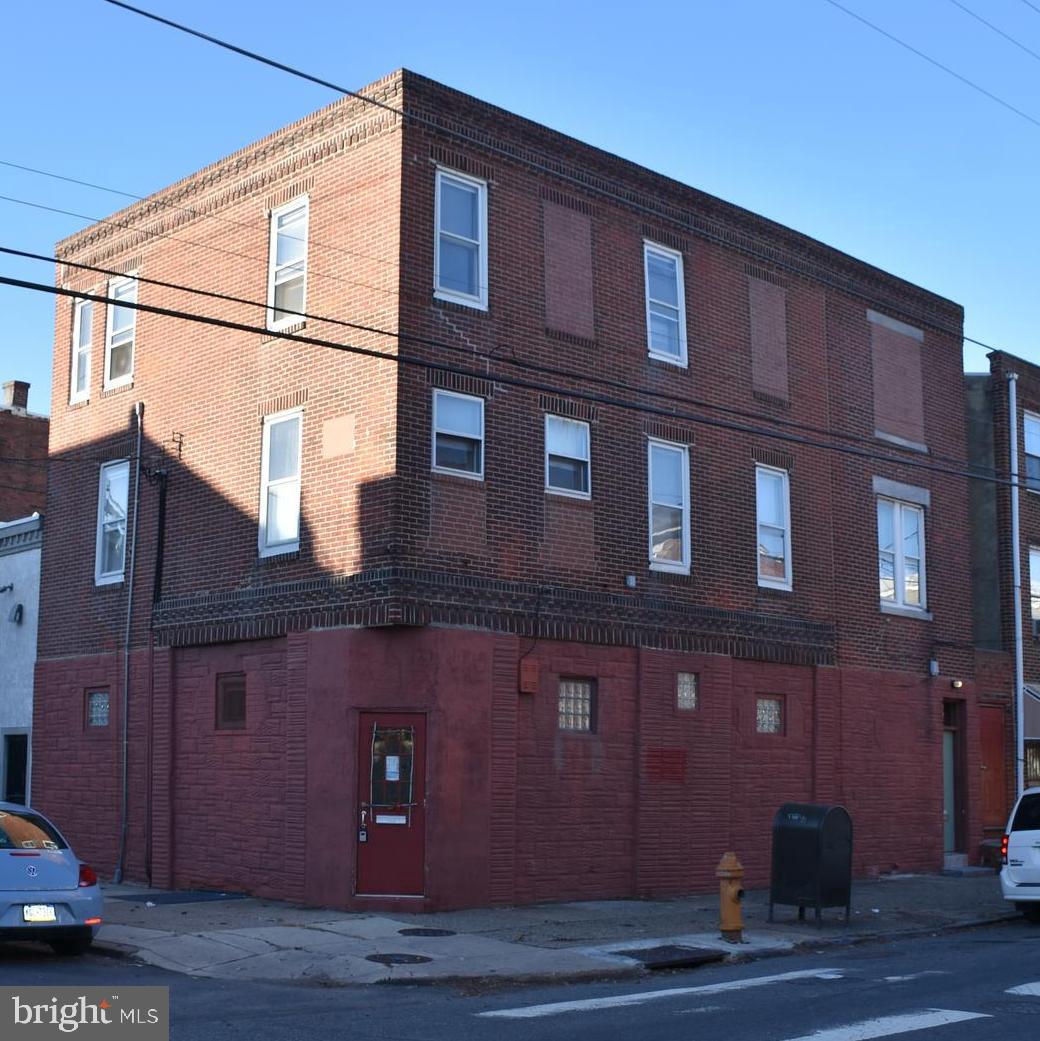 Investment opportunities await! This very flexible triplex is nestled between Queens Village and the Passyunk area of South Philly. Just blocks from South Street, and loads of famous Philly institutions like Pat's Steaks, the Italian Market, Johns Water Ice, and so much more. The first floor features a sizable commercial space (most recently used as a pottery studio), with a separate living room and bathroom with laundry. On the second floor is a sensible and stylish one bedroom apartment with a living room and a full kitchen. There's plenty of natural light and the hardwood floors accentuate the charm. The third floor apartment has a separate entrance and features 2 large bedrooms, a large kitchen and a living room. With the right touch, this property is an investment gem, great layouts and superbly located. Call for an appointment today.