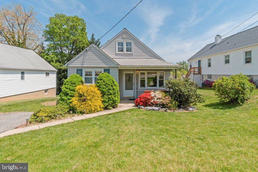 Charming and full of potential, this adorable 4 bedroom 1.5 bath bungalow features a welcoming covered front porch and beautiful hardwood flooring in the main-level bedrooms, with hardwood also hidden beneath the carpet in the living and dining rooms. The fully finished walk-up basement includes a family room with built-ins, a bonus room, and plenty storage space. Enjoy the sizable, flat yard with a shed, perfect for outdoor entertaining or gardening. Additional highlights include a two-car driveway and major updates: roof (2020), HVAC (2025), water heater (2022), and stove and fridge (2023). This well-maintained home is move-in ready and waiting for your personal touch!