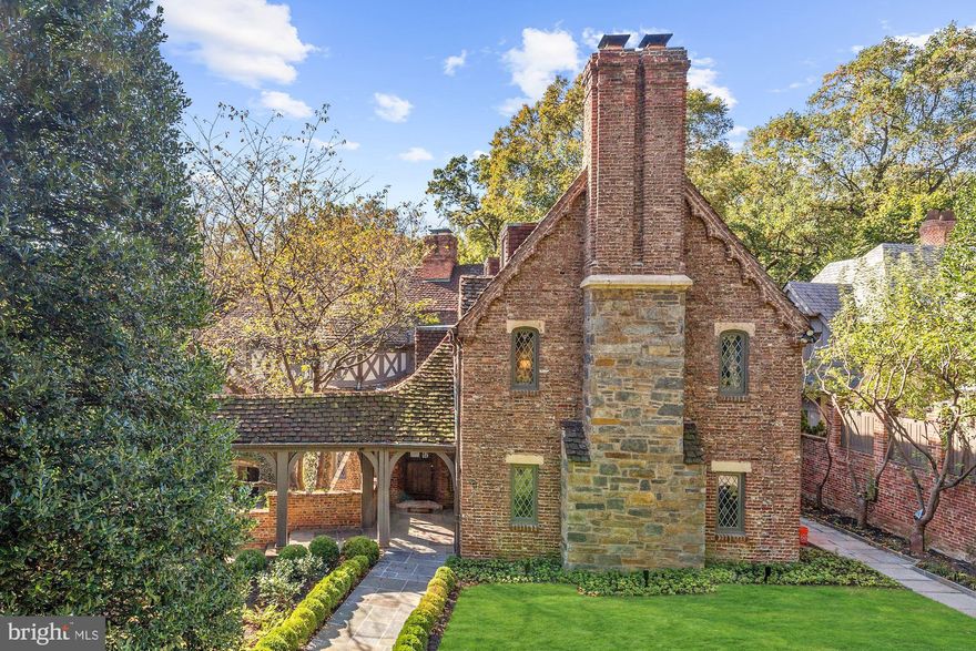 This grand 1930s residence commands a distinct curb appeal and stature with an elegant approach through a porte-cochere to the stately front entrance, lush landscaping, and motor court beyond. Countless recent updates throughout approx. 8,350 SF of Embassy-sized formal principal rooms, comfortable living spaces, period details, new professionally designed chef's kitchen. 6 Bedrooms, 6 Full + 2 Half Bathrooms, 7 fireplaces, Wine Cellar, Catering Kitchen, and more on 4-levels. The nearly Half-Acre lot includes 2-car garage and motor court, one of the most private and largest residential swimming pools (42'x20') that you will find in the District.  Must See!