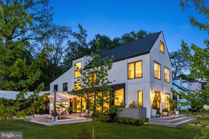 Some homes are built. This one was crafted.

Tucked at the end of a quiet street in sought-after Alcova Heights, this stunning Nordic-inspired custom home stops you in your tracks before you even walk through the door. The crisp white exterior, dramatic gabled rooflines, and bold black-framed windows make a statement that's equal parts architectural and effortlessly cool.

Step inside and the design only gets better. The chef's kitchen is the heart of the home — anchored by a one-of-a-kind layered waterfall countertop that you genuinely won't find anywhere else. Framed by dramatic wall-to-wall windows, it looks out over the home's secluded corner setting, drawing in soft natural light and a sense of privacy that elevates everyday living from hosting a dinner party, to savoring a quiet morning cup of coffee. Custom brass fixtures, Moroccan and marble tile, and thoughtful built-ins carry throughout, giving every room that "did they hire a designer for this?" feeling.

The primary bath is in a category of its own — a light-filled wet room wrapped in floor-to-ceiling tile that feels more like a luxury treehouse retreat than a bathroom. You may never want to leave.

Outside, the fully fenced yard with an automatic driveway gate and irrigation system, is ready for everything — summer evenings under string lights, kids on the in-ground trampoline and play set, and weekend gatherings on the patio. And the location? Unbeatable. Open green space next door, a scenic creekside trail to the neighborhood park right across the street, and Washington, DC just minutes away.

The cherry on top: a fully separate modern apartment above the garage with its own private entrance, ideal for rental income, guests, in-laws, or a work-from-home setup that actually feels like getting away from it all.

Homes like this don't come around often. Design-forward, move-in ready, and perfectly positioned, this is the one.