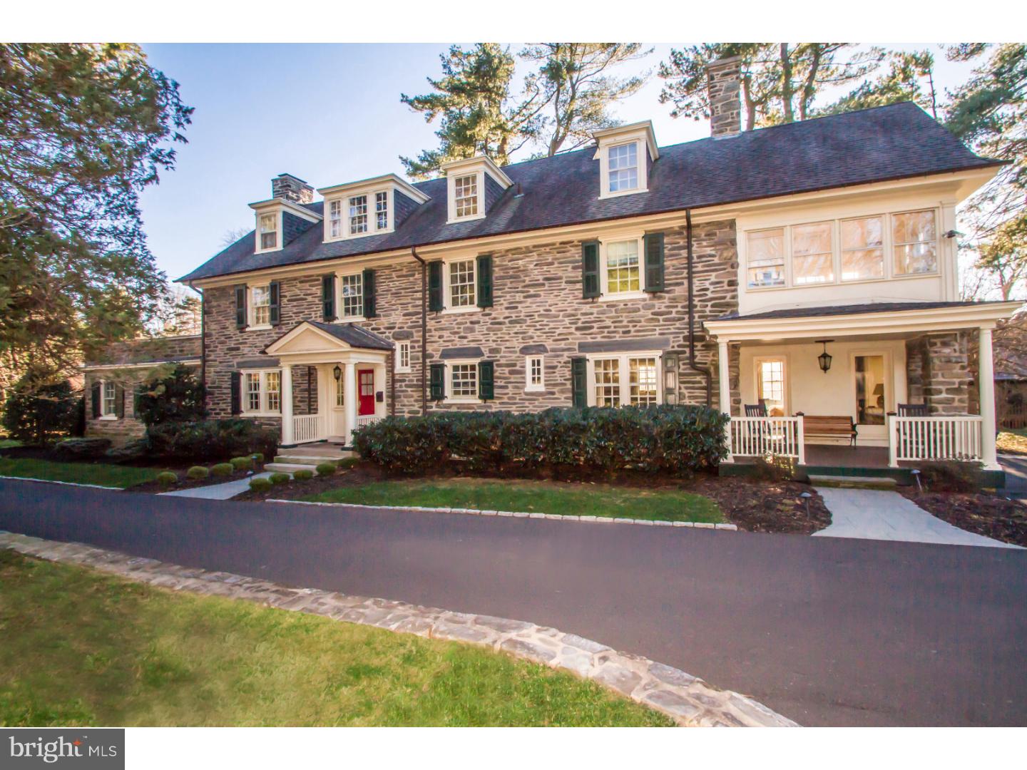 Featured on several house tours, this elegant Brockie & Hastings designed Chestnut Hill home has been beautifully renovated. Built in 1912 in the Colonial Revival style, with six bedrooms, three full and two half baths, this lovely stone home is recognized as Historically Significant on the National Register. The gracious living spaces include stunning architectural features such as Brazilian cherry floors, custom wainscoting, crafted wood archways, a coffered family room ceiling and three wood burning fireplaces with custom mill work. A fabulous kitchen with Gravina granite counter tops, six burner Viking stove, new Bosch dishwasher and a butler's pantry with a large Eurocave wine storage system are additional luxurious features. A generously sized master bedroom and en suite bath, large upstairs sun room and five additional bedrooms and two baths allow plenty of living space without being overwhelming. Lovely outdoor areas include a patio and covered porch and beautifully landscaped gardens on over an acre of lush grounds. Superbly maintained and upgraded systems throughout with four zoned heating and air conditioning, nine year old roof and furnace. Located on one of the most sought after streets in Chestnut Hill within a short walking distance to shops, restaurants, both train lines, and the Wissahickon Park trails, this beautiful home is in move-in condition.