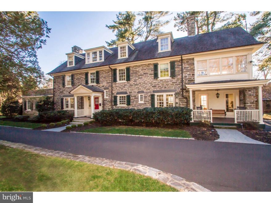 Featured on several house tours, this elegant Brockie & Hastings designed Chestnut Hill home has been beautifully renovated.  Built in 1912 in the Colonial Revival style,  with six bedrooms, three full and two half baths, this lovely stone home is recognized as Historically Significant on the National Register. The gracious living spaces include stunning architectural features such as Brazilian cherry floors, custom wainscoting, crafted wood archways, a coffered family room ceiling and three wood burning fireplaces with custom mill work. A fabulous kitchen with Gravina granite counter tops, six burner Viking stove, new Bosch dishwasher and a butler's pantry with a large Eurocave wine storage system are additional luxurious features.  A generously sized master bedroom and en suite bath, large upstairs sun room and five additional bedrooms and two baths allow plenty of living space without being overwhelming.  Lovely outdoor areas include a patio and covered porch and beautifully landscaped gardens on over an acre of lush grounds.  Superbly maintained and upgraded systems throughout with four zoned heating and air conditioning, nine year old roof and furnace.  Located on one of the most sought after streets in Chestnut Hill within a short walking distance to shops, restaurants, both train lines, and the Wissahickon Park trails, this beautiful home is in move-in condition.