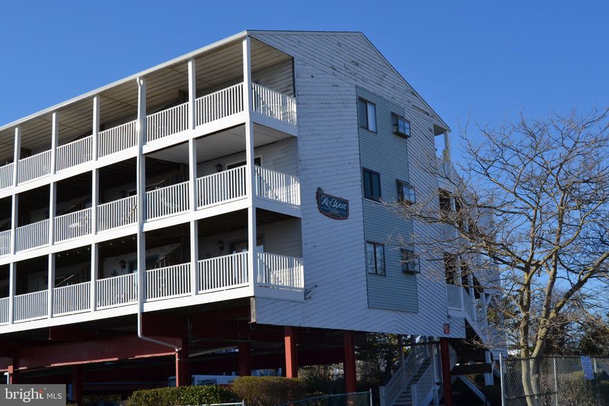 You couldn't ask for a better Condo!  If you are looking for a beautiful ready to enjoy home look no further.  This cozy efficiency is 496 square feet of useable space with all of the features that you need.  Fully furnished this condo easily sleeps a family of 5 with the cutest Murphy Bed.  Hang out on the deck with views of bay and enjoy those beautiful sunsets.  The refrigerator will be brand new and the condo comes with a one year Home Warranty.  Great location -  just blocks from the boardwalk and right next door to Jolly Rogers Amusement Park as well as numerous dining choices.  The building has a new roof installed in 2022 and the walkways, screen doors, balcony railings and stair towers were renovated in 2016.  This condo has only had 4 owners and has never been in a rental program so it is in pristine condition.  This cutie will not last long - schedule a showing today! Elevator and parking included.