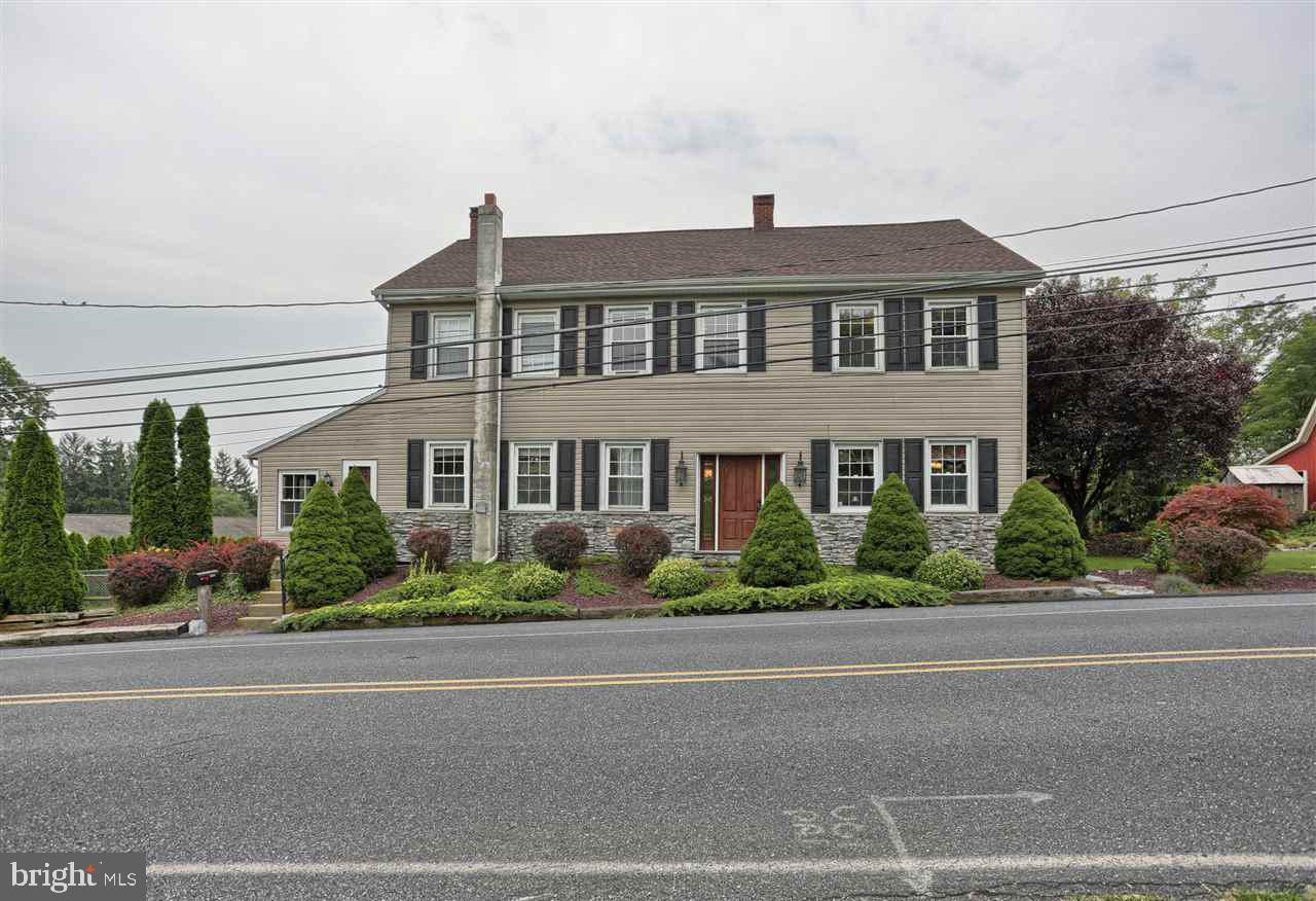 Charming 1800's home located on a beautiful 1.2 acre lot with view of neighboring stream and limestone bridge. Stone patio w/pergola, fireplace great for bar-b-qing and large deck to enjoy the view! The main house offers large foyer w/electric fireplace, charming kitchen w/ exposed beams and antique stove, LR, office w/ stone feature wall and built-ins, 3 br, 2 ba and laundry room. The in-law suite offers LR, eat-in kitchen, sunroom, 2 br, 1 ba and private entrance.