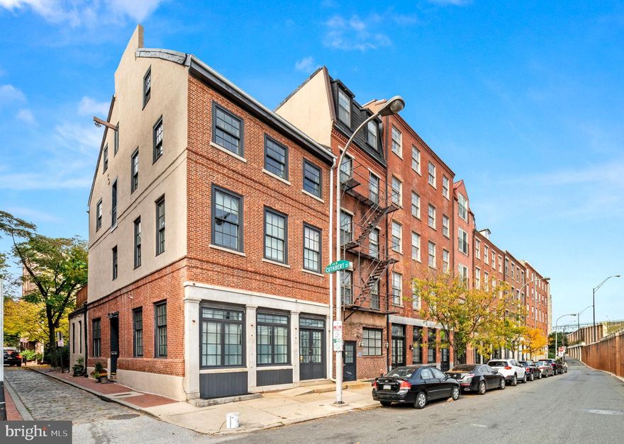 Welcome to 101 Cuthbert, a 200 year-old former pill factory in the Old City section of Philadelphia. Built in 1785 for John Clifford, this thoughtfully divided piece of history offers over 4500 sq/ft of living space and perfectly blends modern improvements with unique original character.  Enter the brick, end or row building off quiet, charming, cobblestoned Cuthbert St. to  the front hallway with exposed beams and glass block floor that sets the tone for this one-of-a-kind 4 Unit building. 
#1 is a 1 Bedroom, 1 Full Bath bi-level unit with access from both Front and Cuthbert streets, and features high ceilings, large windows, wood floors, and well-designed storage space. Enter to find a hall closet and Full Hall Bath before continuing to the main Living area boasting a Kitchen with bright white cabinetry and a beautiful butcher block countertop. The open-floor plan includes a spacious Living room and Dining nook filled with an abundance of natural light. The spiral staircase leads to the Bedroom featuring rustic wood floors, recessed lighting, walk-in closet, and laundry & utilities (including the electric for the entire building in the closet to the left of the bedroom)
#2 is a 2 Bedroom, 2 Full Bath bi-level unit featuring high ceilings, large windows, wood floors, and plenty of flexible living space. Enter into the Living Room featuring a gas fireplace and into the adjoining Kitchen boasting bright white retro cabinetry, Quartz countertops, and stainless steel appliances. An original “walk-in safe” provides additional pantry storage. Continue to the Bedroom with convenient outside access and stylish Bathroom en suite featuring a Tub Shower Combo. Head downstairs to find the 2nd Bedroom and/or Recreation room, Full Bath with a large marble, mosaic tile walk-in shower, and a green glass skylight, with gorgeous metal work. A large walk-in closet/storage, separate laundry area, and utilities complete this unit. There is an in-floor hatch that leads to the sub basement in the main floor bedroom. The sub-basement stretches the whole length of the building.
#3 is a 1 Bedroom, 1 Full Bath 2nd floor unit featuring high ceilings, large windows with wood floors, and a large private deck overlooking Cuthbert St. Enter to find convenient hall laundry and Full Hall Bath featuring a marble tile shower/Jacuzzi tub combo and stylish vanity for storage. The Bedroom has steps up to access the nice large deck. Continue to the open-floor plan main Living area boasting a Kitchen with bright white cabinetry, Quartz countertops, stainless steel appliances, and a spacious Living/Dining room with an abundance of natural light and beautiful bridge views. 
#4 is a 2 Bedroom, 2 Full Bath bi-level unit featuring large windows, original hardwood floors, Juliette balcony, exposed brick, and beautifully preserved original factory details. Enter into the Foyer with convenient laundry and hall closet before continuing to the open-floor plan Main living area. The Kitchen boasts bright white cabinetry, recessed lighting, Quartz countertops, tile backsplash, stainless steel appliances, a large pantry and center island for additional seating. The Living/Dining rooms offer plenty of flexible living space with an abundance of natural light and beautiful bridge views. The gorgeous hardwood floors continue upstairs to the Primary ensuite featuring a skylight, exposed brick, vaulted ceiling, and Full Bath with marble tile shower/tub combo and tile floor. The 2nd Bedroom is quite unique and features the thoughtfully preserved original workings of the factory. A tiled Full Hall Bath with shower/tub combo completes this incredible unit. Central air in all 4 units, fantastic original details, and property can be conveyed with or w/o the 2 long-standing tenants in 1 and 3. Invest & make bank on the rent or move into the owner’s unit and rent out the rest to pay your mortgage! You don’t want to miss this amazing opportunity to own a piece of Philadelphia history!