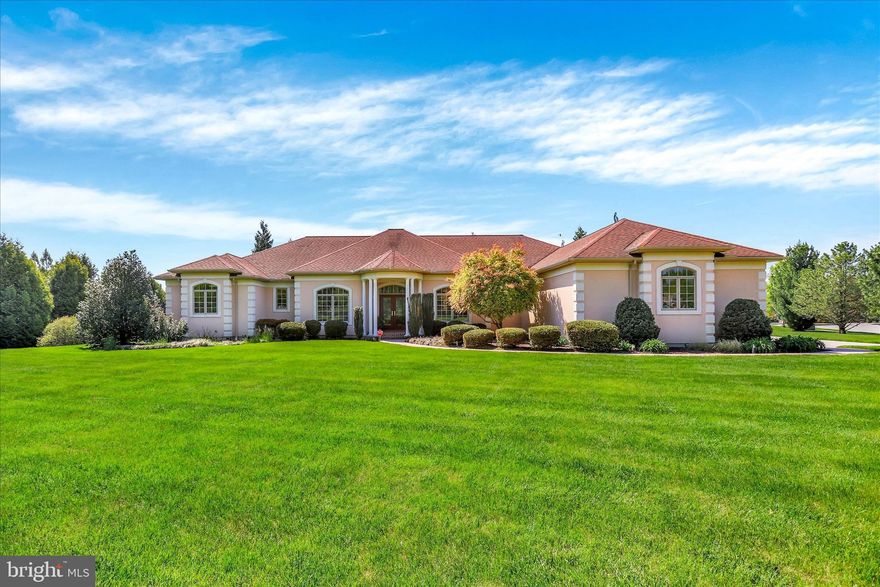 Exquisite, custom built home, by Jeff Henry, nestled in the prestigious Thornhill community—an exceptional offering where thoughtful design meets refined craftsmanship. Boasting over 3,000 square feet of elegant main-level living, with an additional 3,000+ square feet on the lower level ready to be transformed to suit your vision, this home delivers both luxury and opportunity.

The striking stucco exterior sets the tone, welcoming you into a residence rich in detail and sophistication. The expansive open-concept kitchen is a true showpiece, featuring custom-designed and handcrafted cabinetry, exquisite granite countertops, and beautifully appointed ceramic flooring. Seamlessly flowing into the family room, you’ll find soaring vaulted ceilings, a gas fireplace, and effortless access to a sun-filled, window-lined sunroom—creating a warm and inviting atmosphere ideal for both everyday living and entertaining.

The primary suite is a private retreat, complete with a tranquil sitting area offering direct access to the rear patio, a dressing area, dual oversized walk-in closets, and a luxurious en-suite bath featuring a garden soaking tub and walk-in shower with waterfall showerhead. Two additional generously sized bedrooms share a well-appointed Jack-and-Jill style bathroom, offering both privacy and convenience, while all baths throughout the home are enhanced with custom sinks and granite finishes.

Designed with both function and elegance in mind, the home also offers formal living and dining rooms, as well as a private office adorned with stunning French doors. A well-planned mudroom and laundry area provide convenient access from the oversized three-car attached garage.

Set on over an acre of beautifully landscaped grounds, the outdoor space is nothing short of captivating. Mature foliage, flowering plants, and natural greenery surround a semi-secluded rear patio, creating a serene, atrium-like setting—your own private outdoor sanctuary. The property is further enhanced by a professionally installed outdoor irrigation system and thoughtfully designed landscape lighting, highlighting the home’s grounds both day and night.

Custom-designed by the seller with an emphasis on quality and detail, this is one of only a few ranch-style homes available in this highly desirable community. Ideally located near shopping and dining, this remarkable property offers an unparalleled blend of elegance, comfort, and convenience.