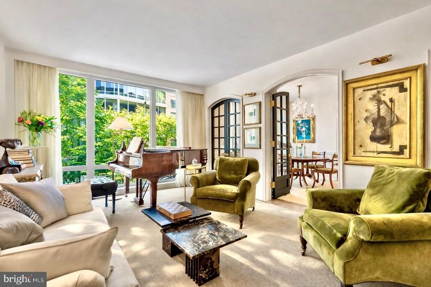 Set on an upper floor of The Ritz-Carlton Residences, West End, this single level residence spans more than 2,000 square feet, delivering what discerning buyers value most, quiet, privacy, and proper room flow and scale, all overlooking a lush, quietly secluded garden courtyard that feels more like a tranquil retreat than a home in the heart of Washington. With eastern exposure and floor to ceiling windows throughout, morning light moves beautifully across the residence, reinforcing its serene, composed atmosphere.

Upon entry, a classic marble foyer sets the tone, introducing an elegant yet comfortable home that is immediately easy to love. The layout is designed with intention, distinct rooms, gracious proportions, and a harmonious progression rather than an open plan compromise. The Living Room connects to the formal Dining Room through custom arched, solid oak and glass French doors. Beyond the dining room, a refined and exceptionally cozy Den with custom built ins completes the entertaining sequence while remaining perfectly suited to everyday living. Throughout, the architectural detailing creates a consistent rhythm between the principal rooms, enhancing flow, sightlines, and comfort.

The private quarters are equally considered, offering two true suites positioned on opposite sides of the residence for privacy and discretion. The Primary Suite, the crown jewel, features dual en-suite baths, the first with a soaking tub and walk in shower, and the second with a walk in shower, connected by a dressing hall that also serves two generously sized custom walk in closets, an exceptionally rare level of convenience even at this tier. Opposite the primary wing, the second bedroom suite includes a custom built in desk, an en-suite bath with tub and shower, and an additional walk in closet, ideal for guests or extended stays without intrusion. Additional highlights of this residence include a myriad of fine fixtures and finishes, the owners sparing no expense. 

Residents enjoy The Ritz Carlton’s renowned standard of service with 24 hour concierge, doorman and porter services, valet parking, on-site management, and on-site engineering. Two garage parking spaces convey, delivering the discretion, ease, and convenience that define premier city living.