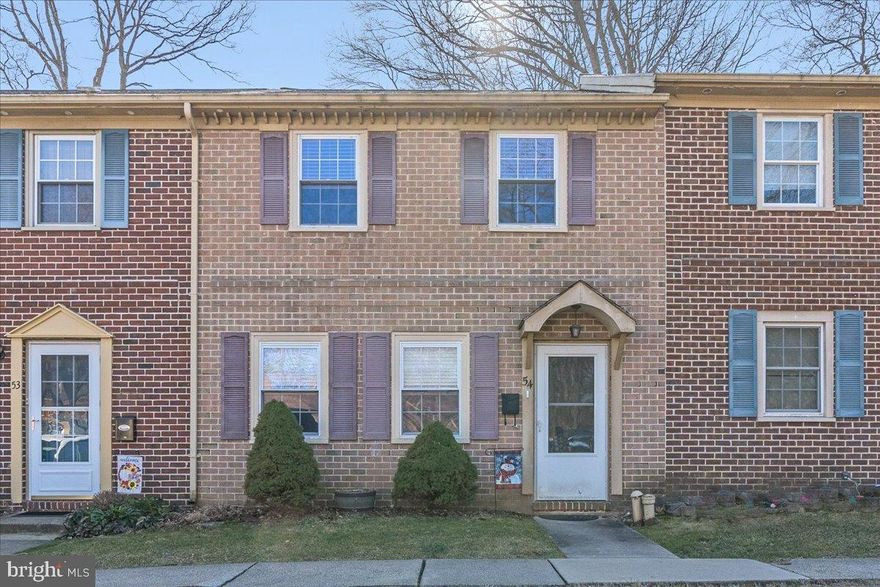 This beautiful brick front townhouse sits off of the main street in this well maintained community with a private fenced in rear yard and open space behind.  Located  within minutes of the best retail shops and restaurants you could desire, as well as Rt 309 and .  Traveling is easy as well being near Rt 309 and Rt. 663.   Enter this home into the large and bright dining room that can host all of your family dinners.  The hall leads to the powder room and into the awesome, centrally located  kitchen with plenty of cabinets and counter space.    With an open concept, you are never far from the action of the family room with warming pellet stove and plenty of seating.  The French doors lead to the patio and level rear yard.  The laundry is also located on the first floor with outside exit to the patio.  The second floor has three bedrooms and a unique bathroom layout that allows access from the back hall or from the main suite.  Don't miss the walk-up attic that has many future possibilities along with tons of storage.  The lucky buyer can move right in and start enjoying this home.   Within the past few  years the HVAC system was replaced, as well as a new  hot water heater.  New carpet was installed, the home was  painted with neutral colors, and the full, bright kitchen was completely remodeled including cabinets, countertops, and all new  appliances.  Both bathrooms were updated with vanities and new tile.  The newest feature is a 49,900 BTU Quadra-Fire pellet stove that easily heats up to 2000 Sq Ft of space.  You will be cozy and warm all winter, every winter!    
2 cats will be in the attic during showings, please keep the door closed when viewing and close when you leave.  Thank you
