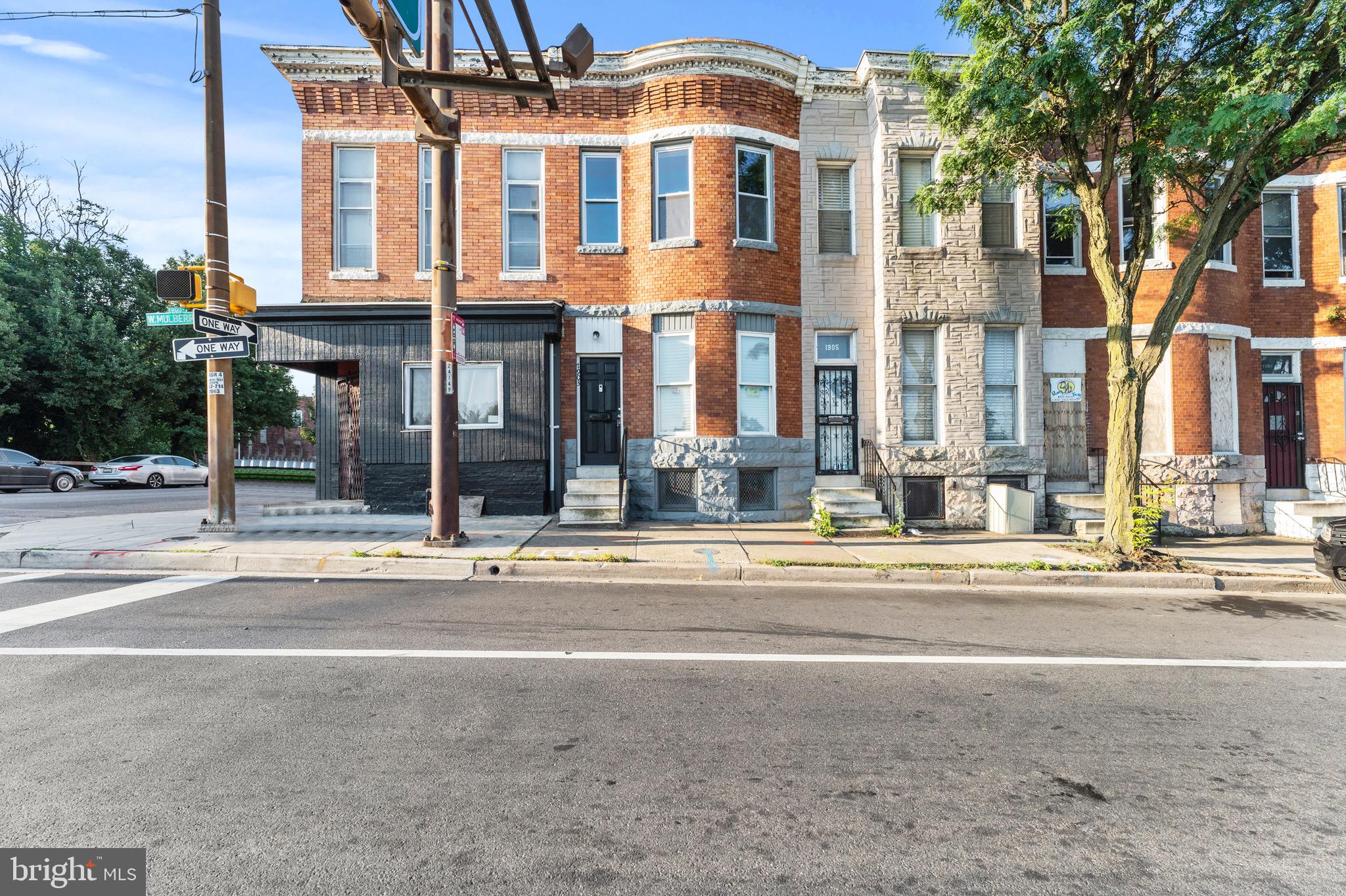 Welcome to 1903 W Mulberry Street; a classic Baltimore row home with timeless charm and modern updates. The main level features hardwood floors and an open layout that flows seamlessly from the living room to the dining and kitchen areas. A half bath on this level adds everyday convenience. Upstairs, you’ll find three generously sized bedrooms with new carpet and a full bath. The unfinished basement offers great ceiling height and plenty of potential to finish or use for storage. Whether you’re just starting out or building your rental portfolio, this home checks the boxes. Fully renovated from a shell in 2020-2021, with updated HVAC, hot water heater, windows, electric, plumbing, and more.
