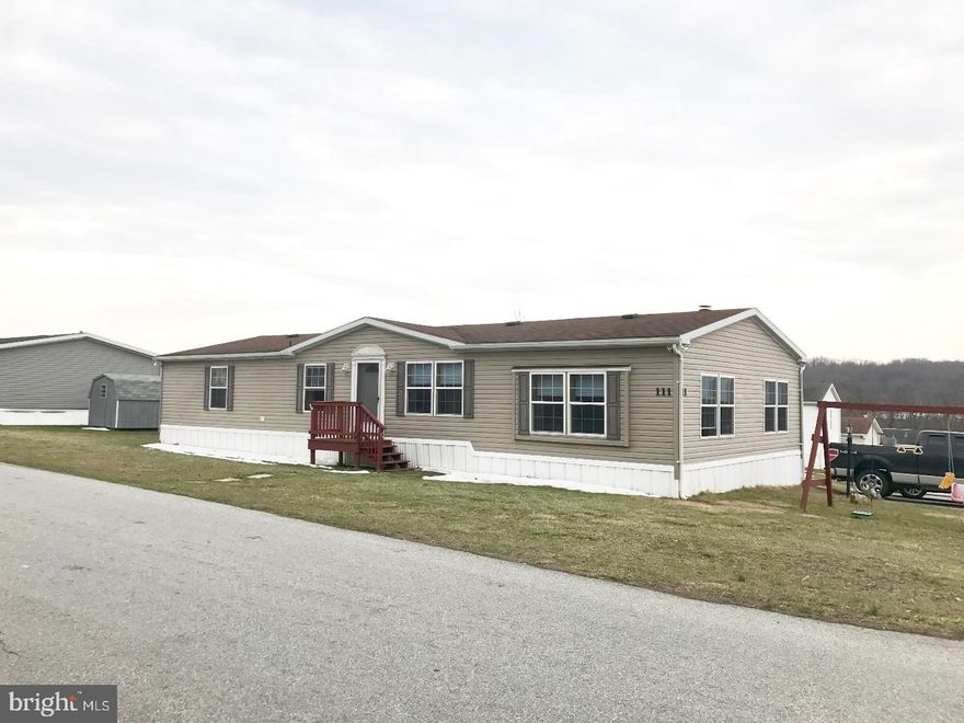 Move in Ready! Immaculate 1653 square feet manufactured home with so much to offer.  Great location, low taxes in desirable Deer Run Park Community. A large Living/Great Room - 16 x 10 with a wood burning fireplace with a blower, and built-in shelves - adjacent to a large dining room and eat in kitchen. Spacious kitchen with lots of cabinets, all appliances are included. Great size Laundry/mud room leads to the side deck. Master has walk in closet with master bath, tub and shower.  Two additional bedrooms, one with a walk in closet and a hall bath. Shed is included. Make this yours!