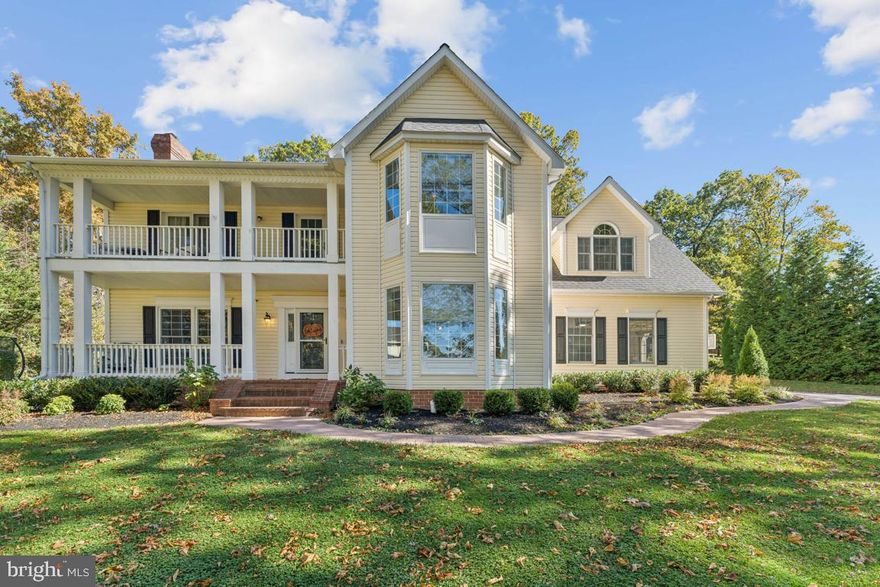 Nestled in the prestigious Ber-Har Heights of Hampstead, this exquisite Colonial home offers a harmonious blend of luxury and comfort. Spanning over 3,500 square feet (above grade), the residence features five spacious 2nd level bedrooms and two and a half elegantly appointed bathrooms, ensuring ample space for relaxation and privacy. Get ready for long baths and showers with your tank-less hot water system providing endless hot water.  Check out the spacious master bath with separate shower, jacuzzi tub, water closet and make up areas in the pictures! The home is highlighted by privately owned (not leased) solar panels with battery backup, you're never without power, not to mention the low, low electric bill.   Step inside to discover a warm and inviting interior adorned with crown moldings and rich hardwood floors. The gourmet kitchen is a chef's dream, boasting upgraded countertops, stainless steel appliances, and a generous island perfect for entertaining. Enjoy casual meals in the breakfast area or host formal dinners in the separate dining room with pocket doors, all bathed in natural light from bay windows. The cozy living room, complete with a marble fireplace, invites you to unwind, while the upper-level laundry adds convenience to your daily routine. The Den off the Living Room is perfect for a main level office or flex room. The home also features a central vacuum system and an attic for additional storage. If that's not enough, there's over 1600 sqft of unfinished basement space waiting for your personal touches & ideas. Outside, the property is a private oasis on 1.21 acres, backing to serene trees and offering panoramic views. Extensive hardscaping, along with an inviting patio and upper balcony off the primary bedroom, create perfect spaces for outdoor gatherings. The side-entry garage, equipped with an electric vehicle charging station, adds to the home's modern conveniences. This residence is not just a home; it's a lifestyle, offering tranquility and elegance in a sought-after community. Experience the perfect blend of luxury and comfort in this stunning property.