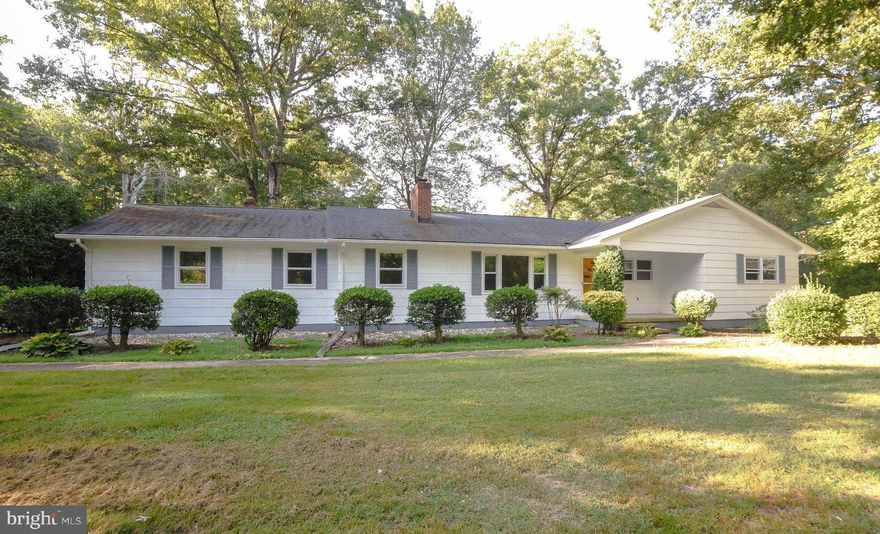 Country  living at its finest ! Rambler on a flat lot with mature trees and landscaping. Detached 2 car garage/workshop.  Wood burning fireplace and woodstove.  Entertain guest  on a large deck . A/C was just replaced and warranty coveys to buyer.