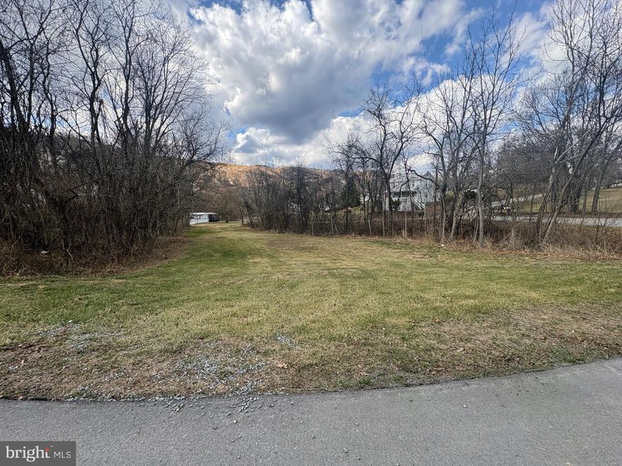 Escape to the country with this 1.52-acre property located just minutes from Berkeley Springs. This peaceful parcel offers a great blend of privacy and convenience, making it ideal for a full-time residence, weekend getaway, or investment opportunity.
The property includes a trailer already on site, providing immediate usability while you plan future improvements. With plenty of open space, the land offers room for outdoor activities, gardening, or expanding the property to suit your needs.
Enjoy the charm and recreation that Berkeley Springs is known for, including its historic downtown, restaurants, shops, spas, and nearby state parks. Whether you're looking for a quiet retreat or a place to build your vision, this property offers plenty of potential.

***Note: Inside trailer pictures are older pics prior to current tenant moving in. ***