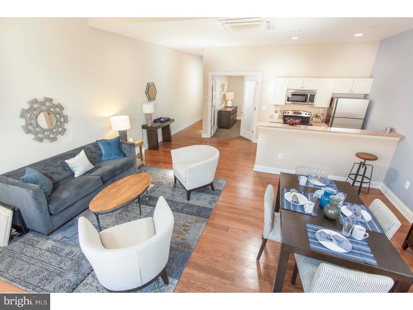Available mid May! Luxury one and two bedroom apartments in a Fabulous location! This 5th floor two bedroom features an open floor plan with oak hardwood flooring, an upgraded kitchen with stainless steel GE appliances, granite counter-tops, and beautiful cabinetry, Bosch washer and dryer in each unit, wall to wall windows with custom sun shades, 2 zone energy efficient heating and cooling systems. The building features a front desk attendant and a brand new fitness center! Located just steps away from Marc Vetri's Osteria, South Jazz Bar and Warm Daddy's! Just 2 blocks from the Broad Street subway. SUPER pet friendly!! On site parking is available at 195 dollars per month. **Photos pictured are from the model unit with a similar floor plan.