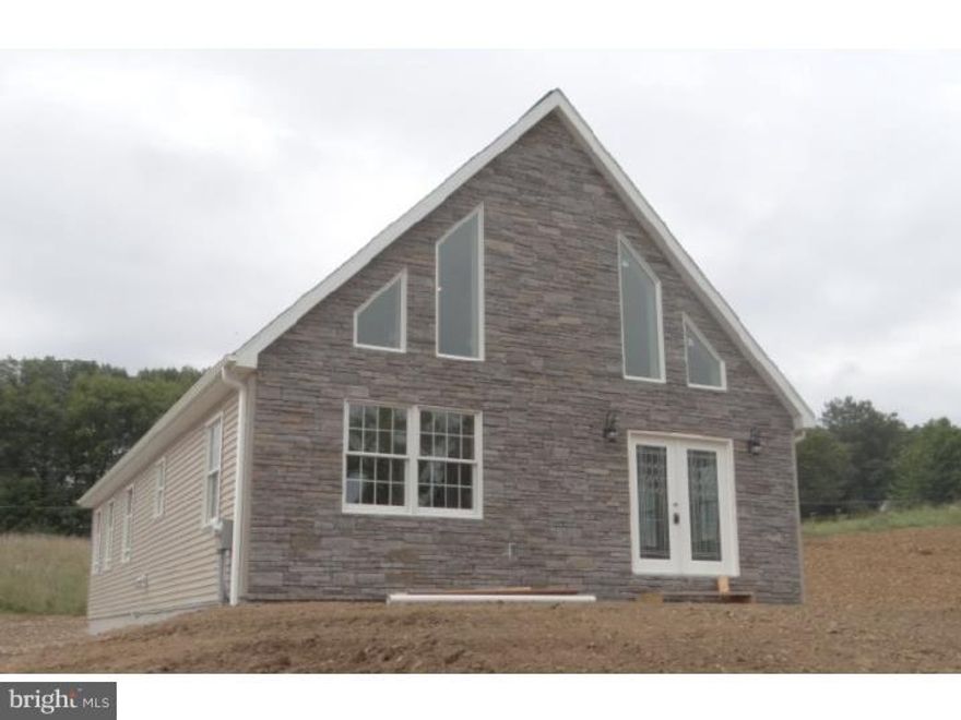 New construction chalet. Open concept layout with 2 story living room dining room & kitchen 2 possible master suite--one on main floor or on 2nd floor. Engineered hardwood in main living areas. Granite counters in kitchen. Cultured marble in bathrooms. Rough-in plumbing for bathroom in basement area to finish off for family room/additional living space.  Beautiful stone exterior in front. 2 driveways & ample parking on upper & lower level. Taxes are land value only.