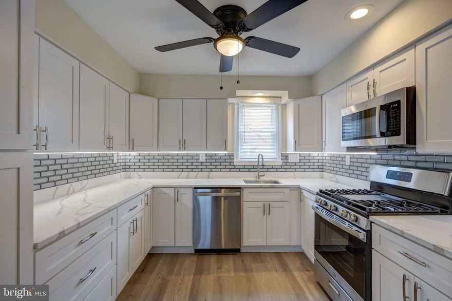 Fantastic 4 Bed 3 Bath Cape Cod in Baltimore County with so many updates! Open concept main level includes renovated kitchen with new cabinets, counters, flooring and appliances; cozy living room with gleaming hardwoods and gas fireplace; sundrenched four-season room with wall of windows; spacious primary bedroom; and new full bath. Upper level boasts two more sizeable bedrooms and updated full bath. Finished lower level (possible in-law suite) features private entrance to great living area, 4th bedroom, and 3rd updated full bath. Additional highlights include oversized 2-car detached garage plus 8 more off street parking spaces; charming front porch; large fenced rear yard; energy efficient double pane windows. Convenient to Towson, Hunt Valley, and Downtown.