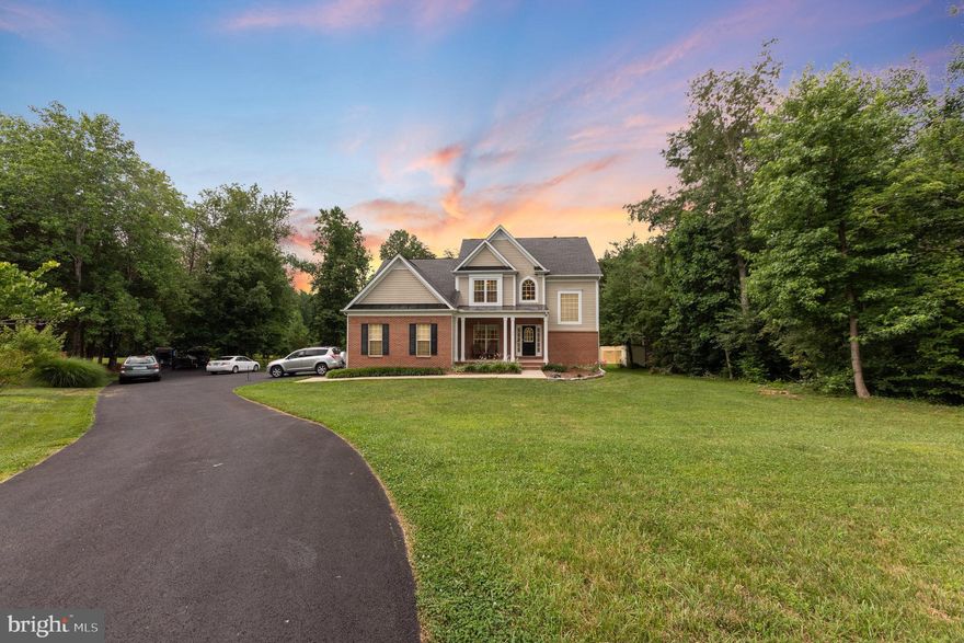 Beautiful Home in Desirable and Quiet Wooded Neighborhood. Minutes from I-95, Shopping, Schools, restaurants and more. 

This home sits on 2.26 acres (Zoned A-2).   It  has many great features among them are:  Open Floor Plan, 5 Spacious Bedrooms, 4 full bathrooms, and lots of natural light throughout, and has been newly painted. 

The Main floor has an open floor plan, with a bedroom, and an adjacent full size newly remodeled bathroom, perfect for visitors and family members. A large kitchen with eating area and large dining room area that flows into the living room, along with a considerable sized walk out deck. The Deck is great for BBQ’s, gatherings, deck furniture, and has a lovely view of the back of the property.  Land is partial cleared and plenty of room to play. This Home has a large attached 2 car garage, with a spacious parking area for 5 or more cars. Driveway has been newly repaved and sealed. 

 Upstairs the primary bedroom can accommodate large bedroom pieces. The bath suite has a sink with granite top and seated vanity area.  Soaking tub, and large separate tiled shower, and water closet. The other 2 bedrooms upstairs can fit full sized beds, with generous sized closets. The second full bathroom upstairs is newly remodeled with a shower and tub.  The large family room on the second story truly makes this a treasure into today’s Real Estate Market. 

The Basement is built out as an in-law suite with sidewalks leading to a ground level walkout entrance; owners have used this as an income producing rental for years.  This includes a large bedroom, living room, kitchenette, and full bathroom, with a washer dryer hook-up. There is a large room in the basement with a closet that is not attached to the in-law suite, but the main house. 

The home also has new LED lighting in the home.  It comes with its own underground fuel tank for the home, an 8X8 shed, a 20 amp emergency generator switch to assist with power outages for your own generator. It also has a whole house water sediment filtration system. The pellet stove is great for heating in the winter.  The three sources of heating for this home will give you many options.
Roof Redone in 2018.