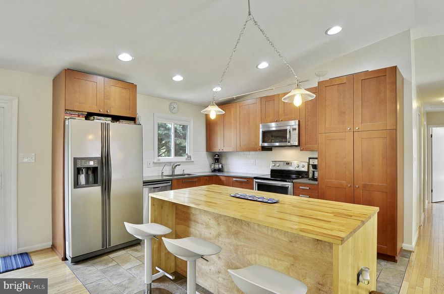 Come see this home-2 acres off the beaten path,only15 mins to Andrews!! 20 to Bolling. 30 to DC! 4 bdrms, 3 full bths w/2 car attached carport. New open kitchen w/quartz counter tops, new appls, new flring. New roof. New water treatment system. 12x25' sunrm. Updated bths. Wood stove. Sliders to deck. Hardwoods. Master with deck overlooking wooded area. Lots of light. Horses allowed.