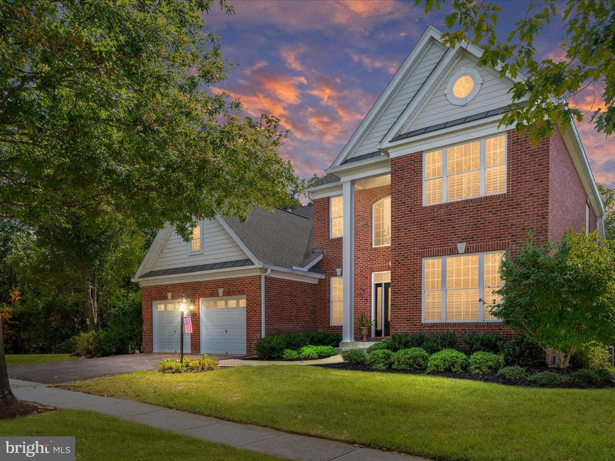 Welcome to 15455 Championship Drive, a stunning and meticulously maintained 4BR/3.5BA home in the heart of Regency at Dominion Valley, Haymarket’s premier active adult, resort-style community. Designed for comfort and ease, this home offers luxurious main-level living paired with thoughtful updates throughout.
Step into the grand foyer where brand new hardwood floors (2024) set the tone for the main level. Just off the entry, a private guest suite with full bath offers comfort and privacy, while French doors lead to a bright home office—perfect for working from home or enjoying a quiet reading nook.
At the heart of the home is the spectacular two-story Great Room, where soaring ceilings, walls of windows, and a cozy gas fireplace create a warm and inviting gathering space. Natural light pours in, framing views of the gourmet kitchen and formal dining area. Recently updated (2025), the kitchen boasts stainless steel appliances, granite countertops, and easy flow into the sunroom. From here, step out to the spacious Trex deck overlooking trees and the 15th hole of the golf course—a serene setting for your morning coffee or evening glass of wine.
The main-level primary suite is a true retreat, offering a large sitting area with custom built-ins, a walk-in closet, and a spa-like bath (renovated 2022) featuring dual vanities, a stand-alone tub, a zero-entry shower, and heated floors.
Upstairs, a versatile loft provides the perfect space for games or TV, accompanied by two bedrooms, a full bath, and a bonus room ideal for crafts, hobbies, or storage.
The lower level is where this home truly sets itself apart. A semi-finished workshop designed for woodworkers, crafters, and DIY enthusiasts offers a rare opportunity to create, tinker, or build in a space tailored for inspiration. With room for tools, projects, and imagination—as well as a half bath and abundant storage—it’s a dream come true for anyone with a hands-on passion.
Recent updates include: hardwood floors (2024), washer/dryer (2025), kitchen refresh (2025), guest bath (2023), sump pump (2023), driveway re-graded/repaved (2022), roof (2015), HVAC (2013), underground sprinkler system, and remote-control blinds in the Great Room and primary suite.
Living in Regency at Dominion Valley means enjoying world-class amenities: Arnold Palmer-designed golf, indoor and outdoor pools, a state-of-the-art fitness center, tennis and pickleball courts, walking trails, lakes, and an outdoor amphitheater.
This warm and welcoming home truly has it all.