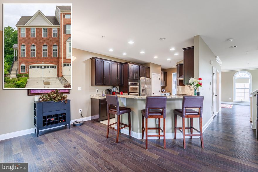 BEAUTIFULLY DESIGNED END OF GROUP TOWNHOME IN THE DESIRABLE ENCLAVES ARUNDEL PRESERVE COMMUNITY!  Features include hardwood floors throughout the main level, open floor plan with living room and dining area, gourmet kitchen w/ granite counters & ss appliances, main level half bath, family room off of the kitchen that leads to rear deck, generously sized Master suite w/ full bath featuring a soaking tub, separate shower, and double vanity, 2 additional bedrooms with a hall bath, finished lower level with a rec room and rough in bath - can easily be converted to a 4th bedroom/3rd full bath, 2 car garage with additional driveway parking!  Incredible community amenities including a clubhouse, junior Olympic pool, tot lot, tennis courts, and walking/jogging path!  Walking distance to the shops and restaurants at Arundel Preserves which include multiple restaurants, Starbucks, Urgent Care, and hotel!