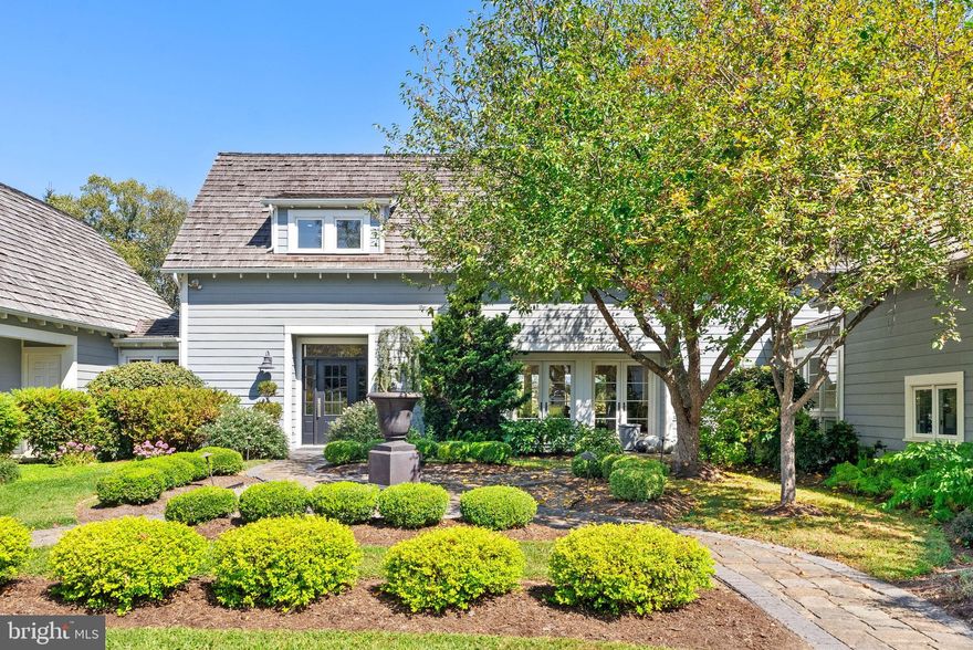 This Cape Cod-style farmhouse features a thoughtfully designed layout, including a main-level primary suite. Stylish renovations include expansive outdoor living with a spa pool, fire pit, private gardens and terraces.The chef’s kitchen is a standout, equipped with top-of-the-line Thermador appliances and a large marble island. Designer touches throughout.  The kitchen area also includes a large bright breakfast room and sitting area.  Main-level primary suite showcases rustic reclaimed wood beams, an antique barn door, and an adjoining private office. An en-suite bath features a soaking tub, walk-in marble shower, and laundry.  The main floor also includes the stunning living room with fireplace, vaulted ceiling and french doors, a built in bar and separate dining room.  French doors from nearly every rear room open to stone patios.  Above the garage, a private guest suite provides ideal space for an au pair, in-laws, or visitors.
The fenced backyard is ideal for pets, and several paddocks.  High-speed fiber internet and Electric vehicle charging station in the garage.  Whole-house Generac generator