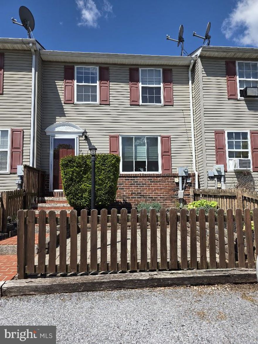 Spacious home featuring 2 large bedrooms and 1.5 baths. Enjoy a finished walkout basement that opens to a peaceful wooded setting with a small stream. The dining room leads to a private deck, perfect for relaxing or entertaining, while the front patio offers additional outdoor space. Nicely landscaped throughout, with 2 off-street parking spaces for added convenience.
