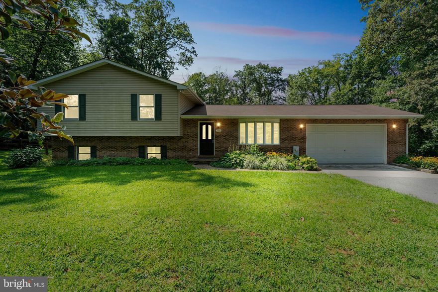 " Seller has a VA assumable loan 27 years 2.99% rate $470,000 balance"   You can't help but fall in love with this very well-maintained home on a "secluded" nature lover's lot which backs to mature trees in the distance. This hidden gem is unseen from Sykesville Rd and offers a paved driveway to a three-car detached oversized garage/workshop in addition to the attached two car garage. French doors off the breakfast area leads to the deck overlooking a gorgeous large and level rear yard with split rail/wire fencing perfect for your furry children. The main and upper level with minimal steps offers three bedrooms with a primary full bathroom, a freshly painted kitchen & breakfast room, refinished hardwood floors and a cozy living room with a bay window. The lower level is nicely improved with a third bathroom, an awesome office with a window and built-ins, a second living room area with a wood stove, a spacious laundry room with lots of cabinets/large sink and a separate utility/storage room. The lower level also provides a walk out to a patio in the rear yard which just adds to the convenience for entertaining guests and year-round family fun. A few bonus features include a four-year-old roof, 400-amp service plus a separate 50 amp for a camper, all window treatments and appliances convey including a brand-new refrigerator. This wonderful property is conveniently located within a short drive to Sykesville, Westminster and 795. This property has something for everyone, come make it your home!