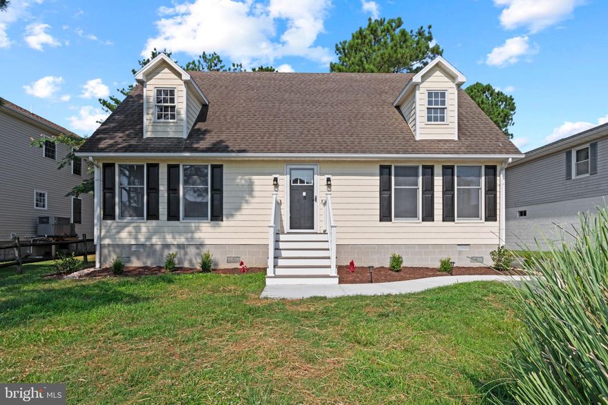 This waterfront Cape Cod style home spans 1,680 sqft, featuring 4 bedrooms and 2 full baths in the desirable Cape Isle of Wight neighborhood. Enjoy an idyllic coastal lifestyle with the added potential for rental income. The sunny main level includes a spacious living room, a dining room with elegant crown molding and direct access to the porch, a kitchen, a recently updated full bathroom, and two bedrooms with charming wainscoting details. The stunning kitchen features newly installed white cabinets, granite countertops, stainless steel appliances, and a white subway tile backsplash accented with a patterned mosaic tile. Upstairs, you'll find two more bedrooms with vaulted ceilings and another fully renovated bathroom.

Savor your morning coffee on the screened porch, cooled by a ceiling fan, or on the patio with views of the canal. Dock your boat conveniently at home on the private boat dock, equipped with a launch and pier. Exterior features also include an outdoor shower, storage space, and a spacious driveway for ample parking. Experience a wealth of amenities in this highly sought-after vacation destination, just a short drive from West and North Ocean City, where you'll find a variety of restaurants and boutiques. Enjoy easy access to golf courses, miniature golf, public boat ramps, the beach, and Isle of Wight Bay for water activities.