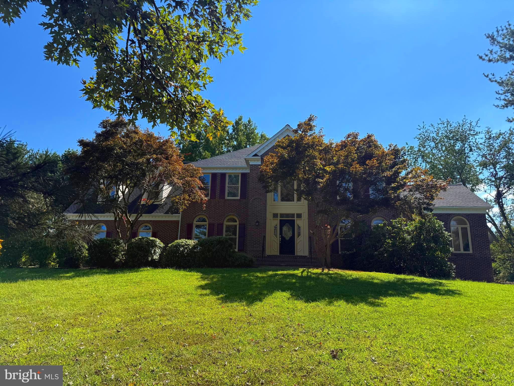 Welcome to an extraordinary 2-acre Colonial, comprised of 5,406 square feet, featuring over $150K remodeling upgrades in 2025. This delightful property is nestled at the corner of Flintridge Drive and Sundown Road. The main floor consists of a renovated kitchen with brand new stainless steel appliances, contemporary white cabinets, and flawless quartz countertops. The FIRST FLOOR, step into the grand two-story foyer with gorgeous hardwood flooring. Formal LIVING and DINING ROOMS show off nearly floor-to-ceiling windows and the beautiful crown molding. The bright SUNROOM with windows floods the space with breathtaking natural light. The cozy FAMILY ROOM with a wood fireplace offers a relaxing and restful retreat. Additionally, the oversized three-car garage includes windows and ample storage. UPSTAIRS, a luxurious PRIMARY SUITE is inviting for a good night’s rest. The master bedroom and library offer a quiet respite with new wall-to-wall carpeting. The ensuite bathroom includes a contemporary full bath with a walk-in shower and an elegant freestanding, soaking tub. Walk into three separate bedrooms with ceiling fans and new carpeting. Lower-level BASEMENT is a spacious, sunlit haven of relaxation, with new flooring and a large recreation room and a WET BAR, opened to the backyard through French doors. A full bath is accessible to the fifth bedroom in the lower level as well. This beautifully upgraded Colonial masterpiece blends classic charm with modern luxury. It offers spacious, light-filled living and high-end finishes—making it a truly exceptional and inviting home.