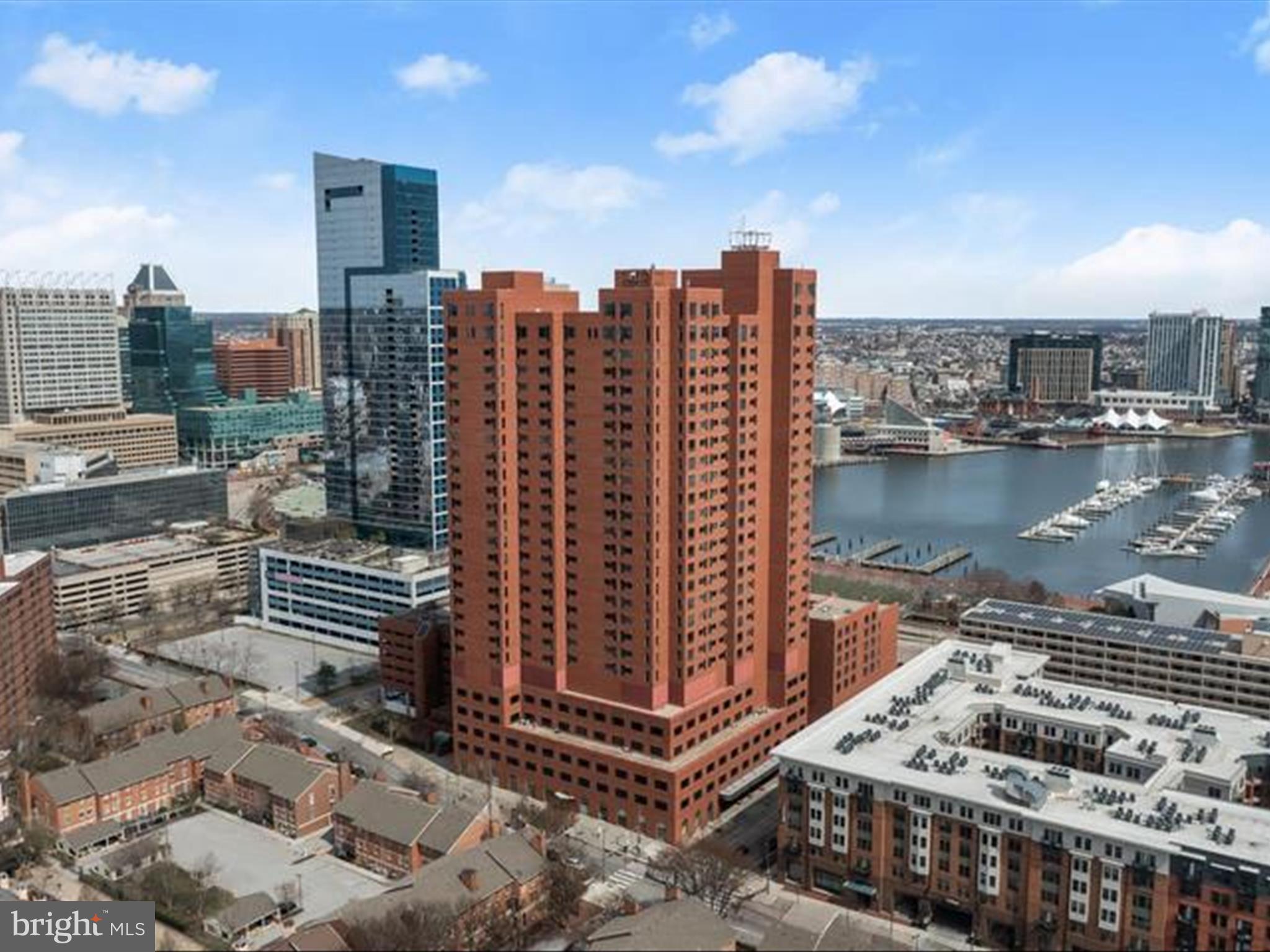 Located in one of Baltimore’s most prestigious addresses, this exceptional residence at The Towers at Harbor Court offers an unparalleled waterfront lifestyle. Positioned directly across from the scenic waterfront promenade and the renowned attractions of the Inner Harbor, this home boasts breathtaking views of the harbor, city skyline and Harbor East through expansive windows in nearly every room. The open-concept floor plan is designed to maximize these stunning views, featuring a living room that seamlessly flows into the dining area and a well-appointed eat-in kitchen. The kitchen is a chef’s delight, complete with ample cabinetry, sleek stainless steel appliances, a center island with a breakfast bar, and decorative backsplash. The primary bedroom provides a peaceful retreat with a spacious walk-in closet and an en-suite bath, while a second bedroom, en-suite full bath, and in-unit laundry complete this remarkable home. This floorplan enhances livability, privacy and versality! Residents of The Towers at Harbor Court enjoy an array of top-tier amenities, including 24/7 front desk service, uniformed doormen, porters, security, and maintenance staff, along with secure parking and additional storage. Further enhancing the luxury experience, the adjacent Royal Sonesta Hotel extends exclusive services such as concierge assistance, fitness center and spa discounts, dining privileges, and access to on-site restaurants, a coffee shop, and guest accommodations. This extraordinary home offers both an unbeatable location and an exceptional standard of living in the heart of Baltimore’s Inner Harbor. Parking spot is #191 and storage is #61