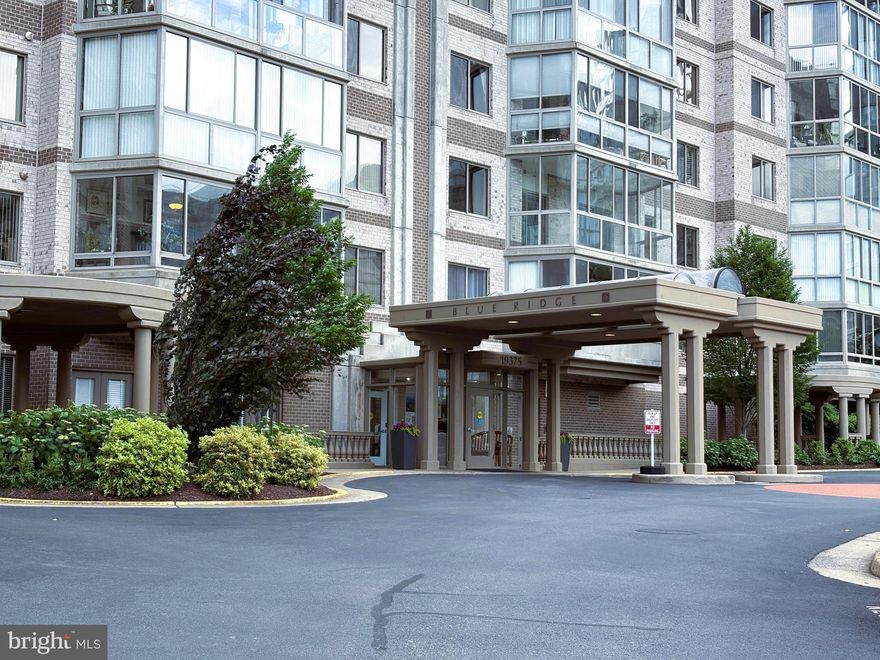 Welcome to one of the most coveted and functional floorplans in the prestigious Blue Ridge building at Lansdowne Woods of Virginia, a vibrant, gated community designed for active adults aged 55 and better (with allowances for residents over 45). This beautifully upgraded 3-bedroom, 2-bath home offers a perfect blend of comfort, privacy, and convenience, featuring a spacious kitchen with a pass-through to the living room—ideal for entertaining—and a layout that places the primary suite on one side of the home, with two additional bedrooms on the opposite side for added privacy. The main living areas feature new luxury vinyl plank flooring, while the bedrooms have been upgraded with plush new carpeting. A newer high-efficiency Carrier furnace ensures year-round comfort and peace of mind. Enjoy the light-filled glass-enclosed balcony with relaxing views, and take advantage of the unit's exceptional location—just one unit from the elevator and steps from a convenient door leading outdoors to a garden area, perfect for pet owners or anyone who enjoys easy access to nature.

Residents enjoy the benefits of a secure, professionally managed building with elegant common areas, individually metered utilities, trash and recycling rooms on every floor, and high-speed internet and cable included. A dedicated garage parking space in the ground-level garage is included, and ample guest parking is available. You'll also love the kind and helpful on-site staff available Monday through Friday, ready tand eager to assist you.

Lansdowne Woods offers resort-style amenities centered around a spectacular 48,000 square-foot clubhouse, complete with a full-service restaurant and bar with patio seating, an indoor saltwater pool with lap lanes and spa, a state-of-the-art fitness center, rooftop tennis and pickleball courts, art and ceramics studios, a woodworking shop, theater, ballroom, library, beauty salon, gift shop, and much more. The community offers beautiful walking trails, garden plots, beekeeping, and a full calendar of clubs, classes, social events, and off-site trips. Transportation is provided for shopping, appointments, and outings, and the 24-hour security gate ensures peace of mind.

The monthly condo fee includes Comcast Xfinity cable TV and high-speed internet, water, sewer, trash and recycling, semi-annual HVAC maintenance, master insurance, clubhouse and building upkeep, snow removal, on-site management, and the Lansdowne Conservancy fee that keeps the grounds beautifully maintained. This is truly resort-style living at its finest—don’t miss this rare opportunity to own one of the most desirable units in Lansdowne Woods!