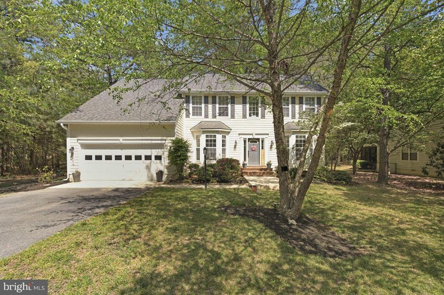 This beautiful four-bedroom, two-story traditional Colonial features a popular floor plan that perfectly blends modern convenience with classic "must-haves." The entry level opens to an inviting foyer leading to a spacious family room with a cozy gas fireplace located just off the kitchen. The main level also offers a private office with French doors and elegant living and dining spaces adorned with crown molding and chair rails. The chef-ready kitchen is equipped with granite countertops, newer appliances and a pantry closet. Upstairs, you will find a convenient laundry room and a luxurious primary suite complete with a sitting area and a full bath featuring a separate tub, shower, and double sinks, along with three additional large bedrooms offering generous closet space. Major updates, including a brand-new roof (2024), newer HVAC (2020), and inexpensive propane heating, provide total peace of mind. Outside, the property backs directly to scenic walking trails and is located in the resort community of Swan Point Yacht and Country Club, just 90 minutes from Washington, D.C. Residents enjoy a vacation-like lifestyle with access to premier amenities, including an 18-hole golf course, a clubhouse, a community pool, tennis and pickle ball courts and a marina.