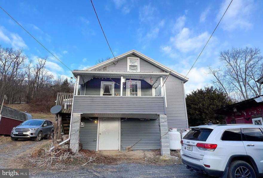 Investment opportunity! Two separate homes on one property. Both homes have newer hard wood floors throughout first level. Roof and windows replaced on both houses in 2012. Mountain views in a quiet area, yet close to restaurants and stores.