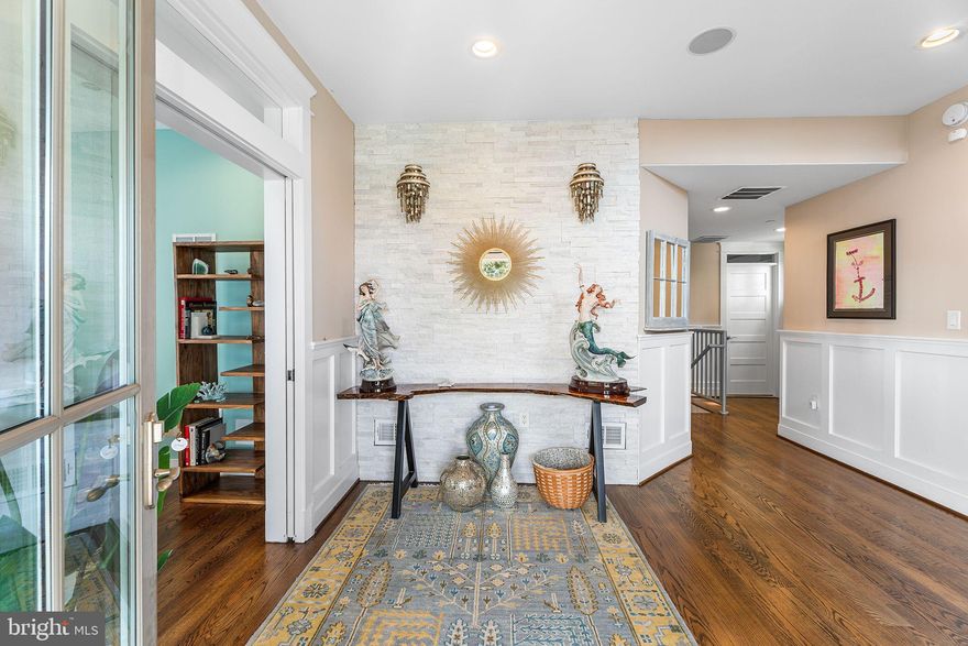 The spacious, thoughtfully designed floor plan features 5 bedrooms, 4.5 baths, an outdoor shower, and a two-car garage. High-end custom details elevate this home, including a private elevator, expansive custom windows and doors, gleaming hardwood floors, a wet bar, and a chef-inspired California kitchen with a premium Viking appliance package.