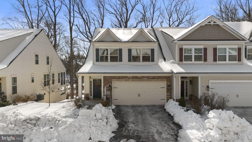 Beautifully appointed end-unit villa-style townhouse offering 4 bedrooms, 3.5 baths, 3,198 finished square feet, and a two-car garage, ideally situated on one of the premier lots in the Walden Woods 55+ community. Abundant natural light fills the home through oversized windows, highlighting 5-inch hardwood floors and a bright, open main living level. The expansive open-concept layout seamlessly connects the dining area, spacious family room with tray ceiling and recessed lighting, and the well-appointed kitchen, perfect for both everyday living and entertaining. The kitchen features GE Café and stainless steel appliances, light granite countertops, a large center island with breakfast bar seating, 42-inch cabinetry with accent lighting, a pantry, and a butler’s pantry/mudroom with direct access to the laundry room and attached garage. A wall of glass off the family room opens to an oversized, partially covered deck overlooking a tranquil, south-facing wooded preserve. The main-level primary suite offers peaceful preserve views, a tray ceiling, a walk-in closet, and a spa-like ensuite bath with a double vanity and a tiled shower with a bench. The upper level includes two generously sized bedrooms, a full bath, and a versatile loft or family room ideal for a home office or lounge. The finished walk-out lower level provides excellent flexibility for guests or entertaining, featuring a recreation room with a custom built-in bar, a lounge, and a game area, as well as a bonus room, a fourth bedroom, a full bath, and access to a covered patio. Residents of Walden Woods enjoy access to outstanding amenities, including a clubhouse, fitness center, meeting and entertainment spaces, and scenic wooded paths.