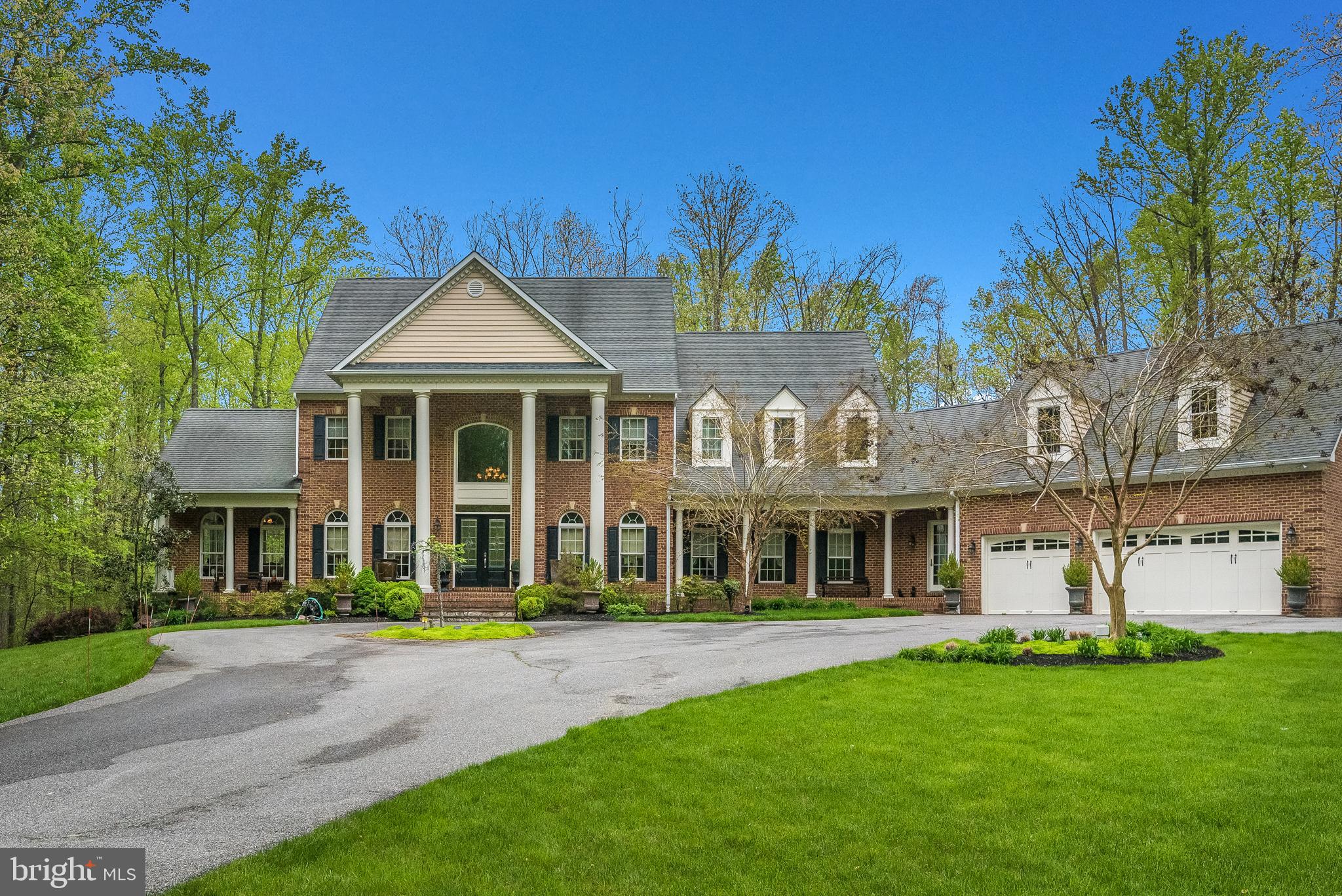 Beautiful Home. Priced well below appraised value of 2.4M. Hidden Pond is your hidden gem once you encounter this incredible luxury home. Over 600 ft of shoreline connects to a large hidden tidal pond enhanced by a secluded island that is deeded with the property. South River Colony Colonial offers 6 Bedrooms and 8 ½ Bathrooms, located on 14+ acres of a wildlife utopia. This beautiful 9000+ square foot home is an entertainer's delight. As you enter the house, you can't help but focus on all the grandeur, including the spiral staircase with wrought iron spindles, soaring two-story foyer, triple crown moldings, and walnut floors. The gourmet kitchen is brilliantly designed to entertain large and small events. The massive island is covered with a thick layer of granite with an enormous amount of storage. The appliances are all top-of-the-line stainless steel. There are two large kitchen sinks, two dishwashers, a six-burner gas stove holding two ovens, a microwave unit, and a large refrigerator/freezer. The marble pass fireplaces are among the many accents in the dining room and the delightful sunroom. Glass French doors open into the wood-paneled library. The sunken family room boasts a floor-to-ceiling stone fireplace; the custom mantel was made from a tree from the property. The first floor has a main-level bedroom, 2 ½ baths, laundry, a dual staircase, and an entry to the garage. Upstairs, the primary bedroom suite offers a separate sitting room, a gas fireplace, a dressing room with mirrors and vanity, and two large walk-in closets. The Primary bath has a separate soaking tub, oversized shower, and heated tile floors. All bedrooms have their ensuite. Above the garage is an au-pair/ office or studio with its full bath and separate heating zone. The lower level is finished, with cork flooring, and block glass. This floor is ideal for dancing, yoga, and gym equipment. Entertain downstairs with the full-size kitchen area, 3rd dishwasher—a custom-built wine cellar accommodating hundreds of bottles. Outdoor entertaining includes an all-season sun-filled porch with Mitsubishi Heat/AC, Gazebo glassed with Trex flooring, a hardscape stone patio, and an in-ground heated saltwater pool with a waterfall. Whole-home generator, underground sprinkler system front and rear yard. The bonus is truly the lush grounds that feature Maryland native plants. All the professional landscaping will bloom all season long. The short walk down the trail brings you to a peaceful, tranquil setting where the sky meets the water showing off a little piece of paradise. A built-in bench awaits the next visitor. Pictures tell the story, but the real-life experience is well worth your tour. In addition, the South River Colony community offers a championship golf course, tennis courts, pool, swim teams, clubhouse, and playground.