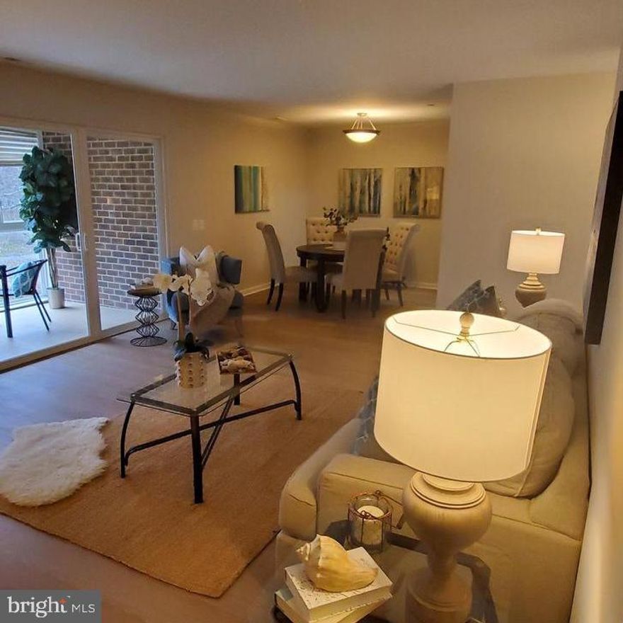 Beautiful, newer unit in the 55+ community of Leisure World that lives like a resort! Built in 2006, this home offers worry-free living as the condo fee includes all utilities, plus high-speed internet and basic cable TV! Upgraded features include luxury vinyl plank floors in the LR and DR, new carpeting in the bedrooms and fresh paint throughout.  The kitchen has plenty of storage and includes Silestone countertops, pull-out drawers and a lazy susan. There's a full-size washer/dryer, a large storage closet, plus a delightful, enclosed balcony with tile flooring and a fantastic view! There's also a fire-repression system and an assigned parking spot!

Community amenities also include an 18-hole golf course, 2 restaurants plus a pub, an outdoor pool and lanai, art studio, woodworking shop, library, MedStar Health Center, banking, post office, walking trails and 24-hour security! Clubhouse II includes the indoor pools, fitness center, billiards and ping pong rooms, auditorium and pickle ball courts. This condo is a terrific value in today's market!