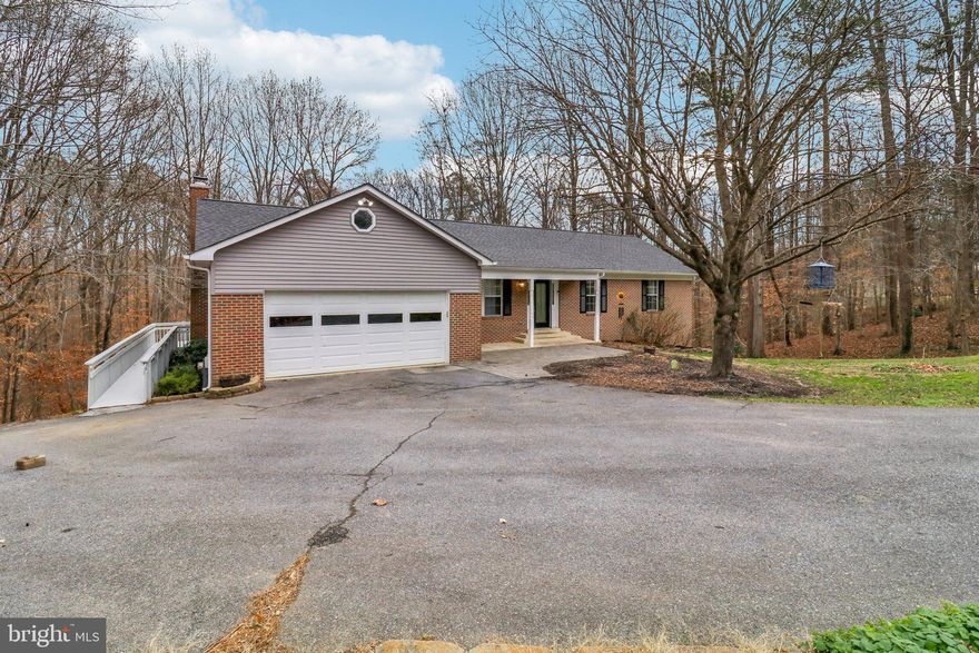 Discover exceptional space, privacy, and flexibility in this beautifully maintained 5-bedroom, 3-bath single-family home set on 1.58 acres in one of Chesapeake Beach’s most peaceful and well-loved neighborhoods.

Perfect for multi-generational living, this home features TWO full kitchens. One on the main level and one on the fully finished lower level- giving guests, extended family, or in-laws their own private retreat with separate living, sleeping, and entertaining spaces. The lower level also includes a spacious bedroom and a dedicated office, ideal for remote work or independent living.

Upstairs, the main level offers a comfortable flow with carpeted bedrooms, generous closets, and a primary suite with its own private bath. A family room just off the kitchen, complete with a cozy fireplace, creates the perfect gathering point for everyday living.

Out back, the property opens to a massive, gently sloped hill- perfect for sledding in the winter and endless outdoor fun year-round. The home also backs to a large, wooded lot, giving you incredible privacy, quiet, and a true sense of nature. Enjoy morning coffee, summer dinners, or weekend entertaining on two expansive rear decks overlooking your private acreage.

With no HOA, a large two-car garage, and tons of outdoor potential, from gardening to play areas to future expansions, this property offers room to grow in every direction.

Families will love being part of an excellent school district and a community known for its friendly neighbors, tranquility, and convenient Chesapeake Beach location.

This is a rare opportunity to own a spacious, versatile home with unbeatable privacy and multi-generational flexibility, all while remaining close to everything Calvert County has to offer.