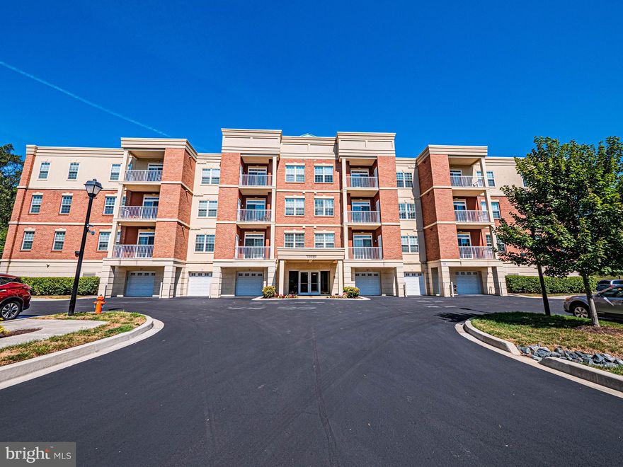 Beautifully appointed condominium in the highly sought-after Turf Valley community of Howard County! Enter through the secure lobby with convenient access to the garage and your own one-car parking space (#1). The open-concept layout features gleaming hardwood floors, a private balcony, and stylish modern updates throughout.
The gourmet kitchen is a true centerpiece, showcasing a large center island with breakfast bar seating, pendant lighting, tile backsplash, 42" cabinetry, granite countertops, and stainless steel appliances, including a high-end refrigerator. The spacious living and dining areas offer the perfect setting for both everyday living and entertaining.
Retreat to the primary suite complete with double closets (including a walk-in), and a shower booth with dual vanities. Community amenities and conveniences abound with shopping, dining, entertainment, and Turf Valley Resort just moments away, plus Harris Teeter right around the corner. Enjoy easy access to major commuter routes including US-40, I-695, and I-70. This home combines comfort, convenience, and an unbeatable location—don’t miss it