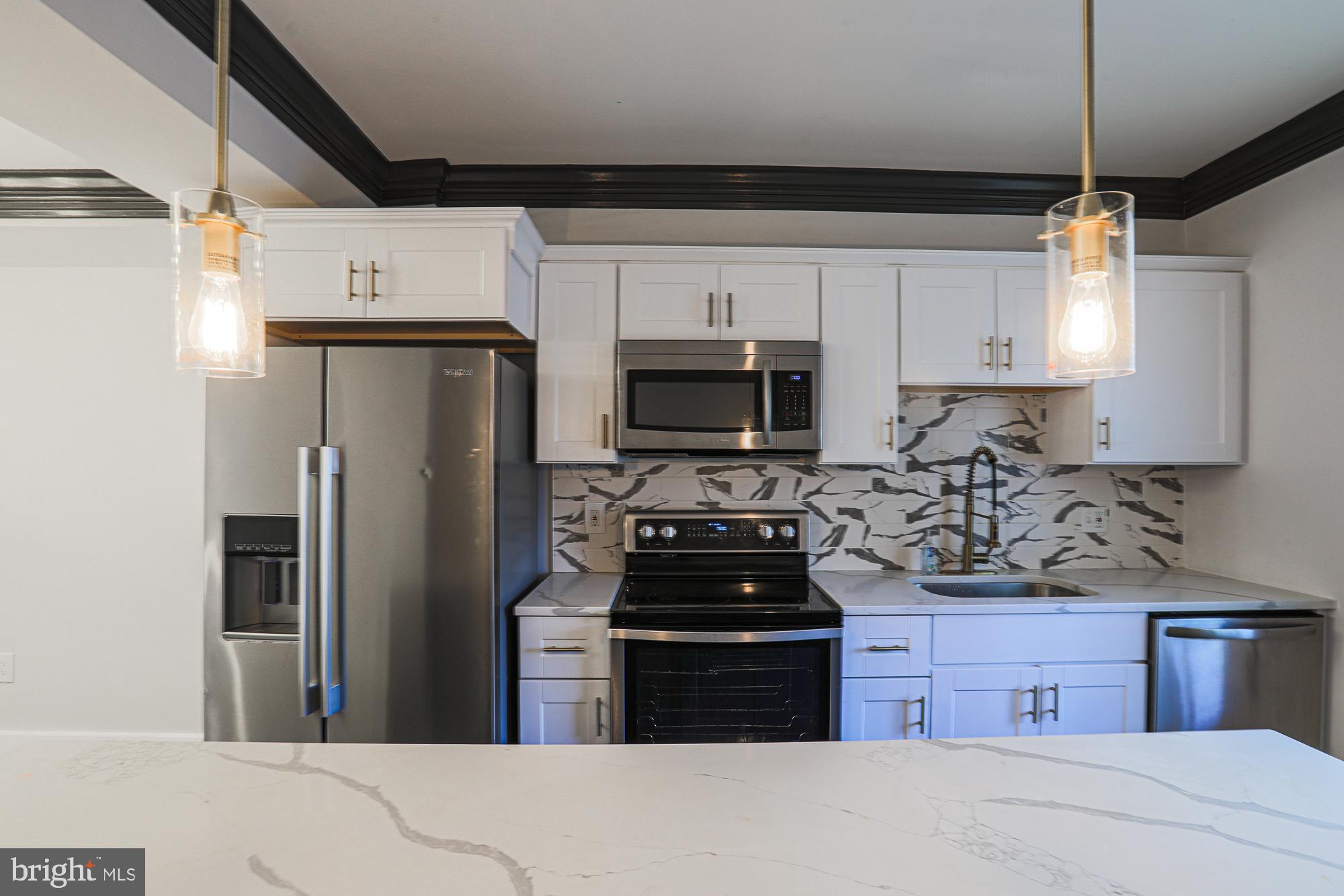 Welcome to Pigtown's newest beautifully renovated 3bd/1ba rowhome! The main floor of the home offers an open floor plan with LVT flooring and updated light fixtures. The kitchen has custom cabinetry, stainless steel appliances, and granite countertops perfect for meal prepping and entertaining. Upstairs you will find a spacious primary bedroom, two sizeable secondary ones, and an updated bathroom with sleek tiling. Downstairs you will find a clean, unfinished basement that is excellent for storage. The exterior of the property is just as beautiful with a brick front. The back of the property can be accessed from the kitchen. The backyard has concrete which is great for entertaining.